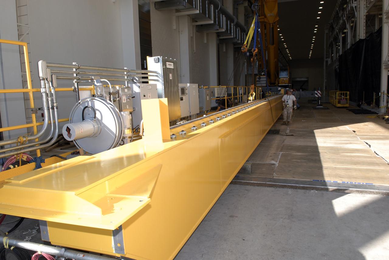 CAPE CANAVERAL, Fla. – Segments of a crane are moved into the Operations and Checkout Building at NASA's Kennedy Space Center in Florida. The new O&C low-bay crane is a 25-ton overhead bridge crane built for Lockheed Martin and Space Florida by American Crane and Equipment Corporation in Douglasville, Pa. The crane has a bridge span of 78’-2” and a hook height of 48’-10”. The crane will be used for lifting and moving flight hardware, fixtures and equipment in support of the Orion spacecraft manufacturing. Part of NASA's Constellation Program, the Orion spacecraft will return humans to the moon and prepare for future voyages to Mars and other destinations in our solar system. Photo credit: NASA/Kim Shiflett