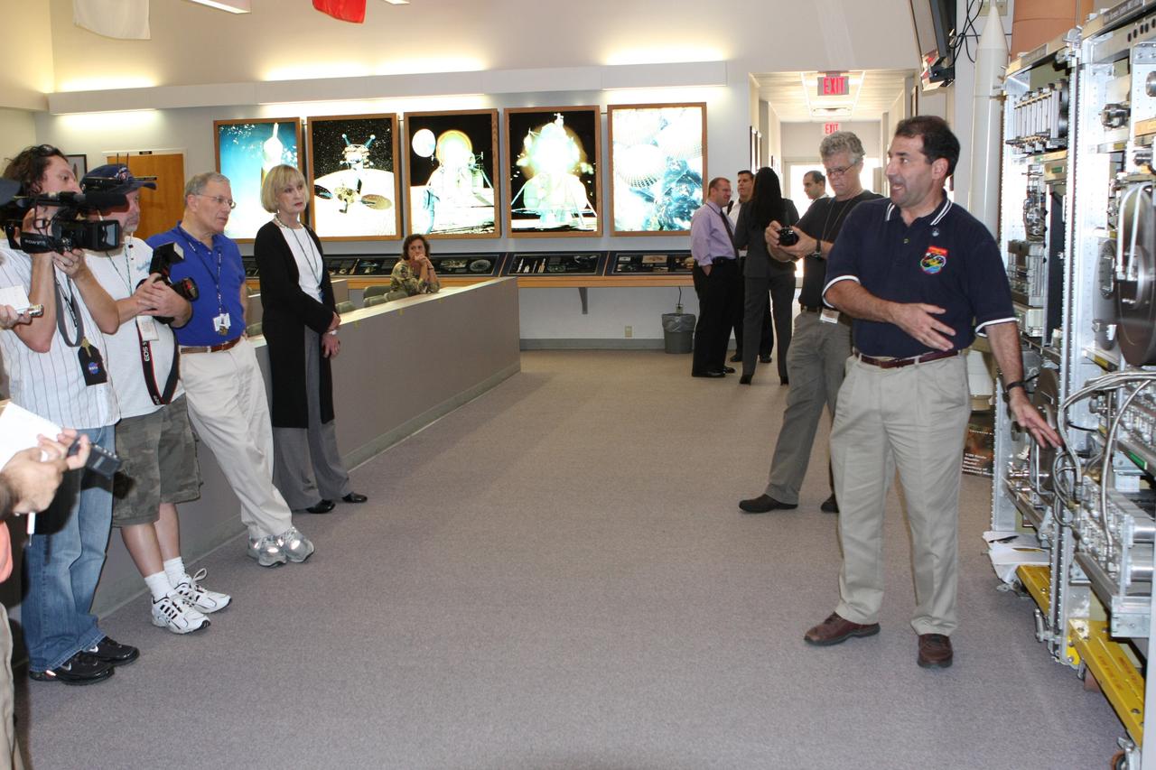 CAPE CANAVERAL, Fla. –  In  In the News Center at NASA's Kennedy Space Center in Florida, Bob Bagdigian (right) talks to the media about the Water Recovery System being delivered to the International Space Station on space shuttle Endeavour's STS-126 mission. Bagdigian is a project manager with NASA's Regenerative Environmental Control and Life Support System at Marshall Space Flight Center in Huntsville, Ala.  Behind Bagdigian is a mockup of the two racks that will be used. The two units of the Water Recovery System are designed to provide drinking-quality water through the reclamation of wastewater, including urine and hygiene wastes. The water that’s produced will be used to support the crew and work aboard the station.  STS-126 is the 124th space shuttle flight and the 27th flight to the International Space Station. The mission will feature four spacewalks and work that will prepare the space station to house six crew members for long- duration missions.  Liftoff is scheduled for 7:55 p.m. EST Nov. 14.   Photo credit: NASA/Dimitri Gerondidakis