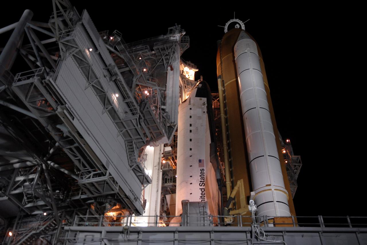 CAPE CANAVERAL, Fla. – On Launch Pad 39A at NASA's Kennedy Space Center in Florida, space shuttle Endeavour is revealed after the rotating service structure begins to roll away. The rollback is in preparation for Endeavour's liftoff on the STS-126 mission with a crew of seven. The rotating structure provides protected access to the shuttle for changeout and servicing of payloads at the pad. It is supported by a rotating bridge that pivots on a vertical axis on the west side of the pad's flame trench. After the RSS is rolled back, the orbiter is ready for fuel cell activation and external tank cryogenic propellant loading operations. The STS-126 mission will be the 124th space shuttle flight and the 27th flight to the International Space Station. The mission will feature four spacewalks and work that will prepare the space station to house six crew members for long- duration missions. Liftoff is scheduled for 7:55 p.m. EST Nov. 14. Photo credit: NASA/Kim Shiflett