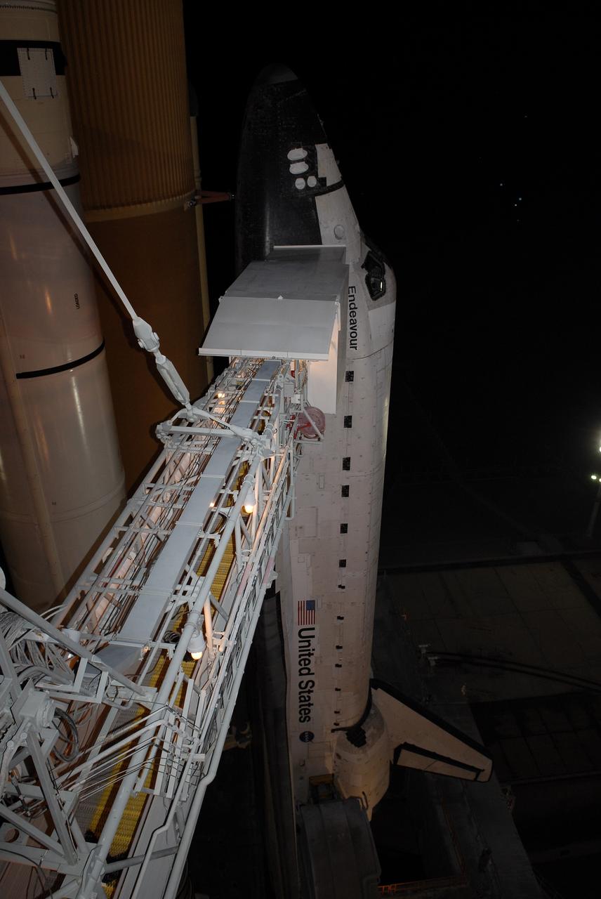 CAPE CANAVERAL, Fla. – On Launch Pad 39A at NASA's Kennedy Space Center in Florida, the orbiter access arm and White Room are extended toward space shuttle Endeavour after rollback of the rotating service structure. The rotating structure provides protected access to the shuttle for changeout and servicing of payloads at the pad. It is supported by a rotating bridge that pivots on a vertical axis on the west side of the pad's flame trench. After the RSS is rolled back, the orbiter is ready for fuel cell activation and external tank cryogenic propellant loading operations. The STS-126 mission will be the 124th space shuttle flight and the 27th flight to the International Space Station. The mission will feature four spacewalks and work that will prepare the space station to house six crew members for long- duration missions. Liftoff is scheduled for 7:55 p.m. EST Nov. 14. Photo credit: NASA/Kim Shiflett