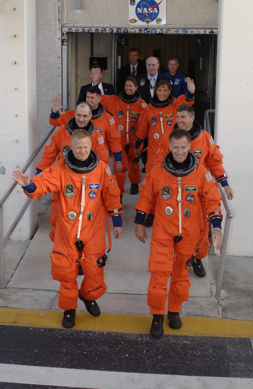 CAPE CANAVERAL, Fla. – At NASA's Kennedy Space Center, crew members for space shuttle Endeavour's STS-126 mission stride out of the Operations and Checkout Building eager to get to the Astrovan that will take them to Launch Pad 39A. From left, clockwise, are Pilot Eric Boe, Mission Specialists Donald Pettit, Shane Kimbrough, Sandra Magnus, Heidemarie Stefanyshyn-Piper and Steve Bowen, and Commander Chris Ferguson. STS-126 is the 124th space shuttle flight and the 27th flight to the International Space Station. The mission will feature four spacewalks and work that will prepare the space station to house six crew members for long- duration missions. Liftoff is scheduled for 7:55 p.m. EST Nov. 14. Photo credit: NASA/Kim Shiflett