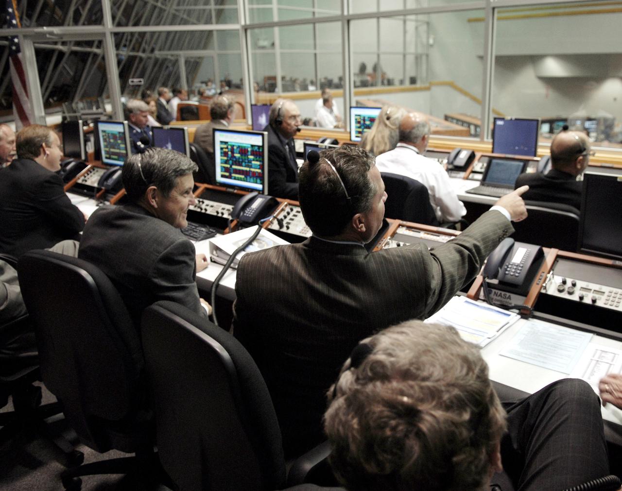 CAPE CANAVERAL, Fla. – Center Director Bob Cabana (center left) watches the successful launch of space shuttle Endeavour on the STS-126 mission in the Firing Room of the Launch Control Center at NASA's Kennedy Space Center in Florida. Liftoff was on time at 7:55 p.m. EST. STS-126 is the 124th space shuttle flight and the 27th flight to the International Space Station. The mission will feature four spacewalks and work that will prepare the space station to house six crew members for long-duration missions. Photo credit: NASA/Kim Shiflett