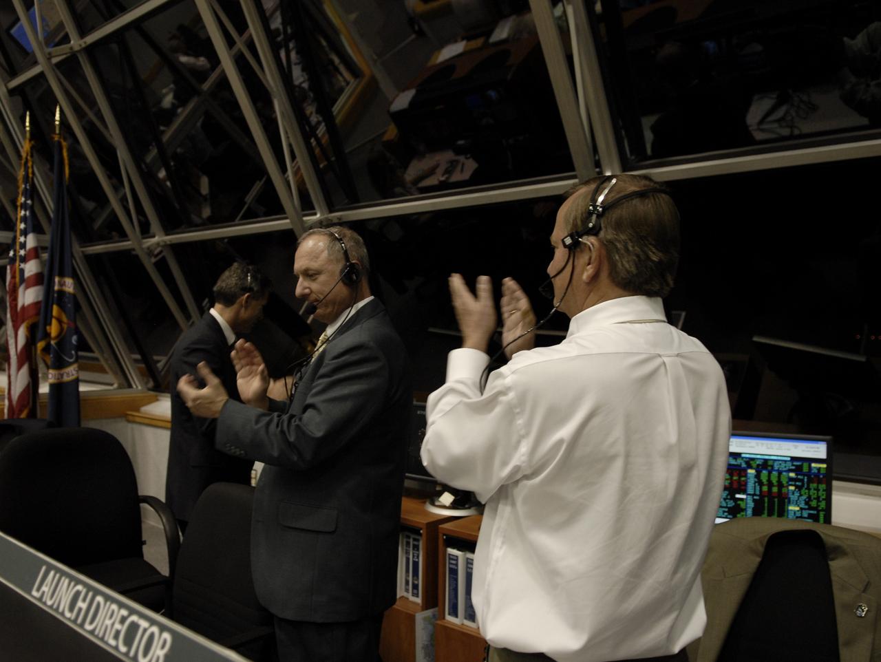 CAPE CANAVERAL, Fla. – In the Firing Room of the Launch Control Center at NASA's Kennedy Space Center in Florida, Shuttle Launch Director Mike Leinbach (right) and others applaud the successful launch of space shuttle Endeavour on the STS-126 mission. Liftoff was on time at 7:55 p.m. EST.  STS-126 is the 124th space shuttle flight and the 27th flight to the International Space Station. The mission will feature four spacewalks and work that will prepare the space station to house six crew members for long-duration missions. Photo credit: NASA/Kim Shiflett
