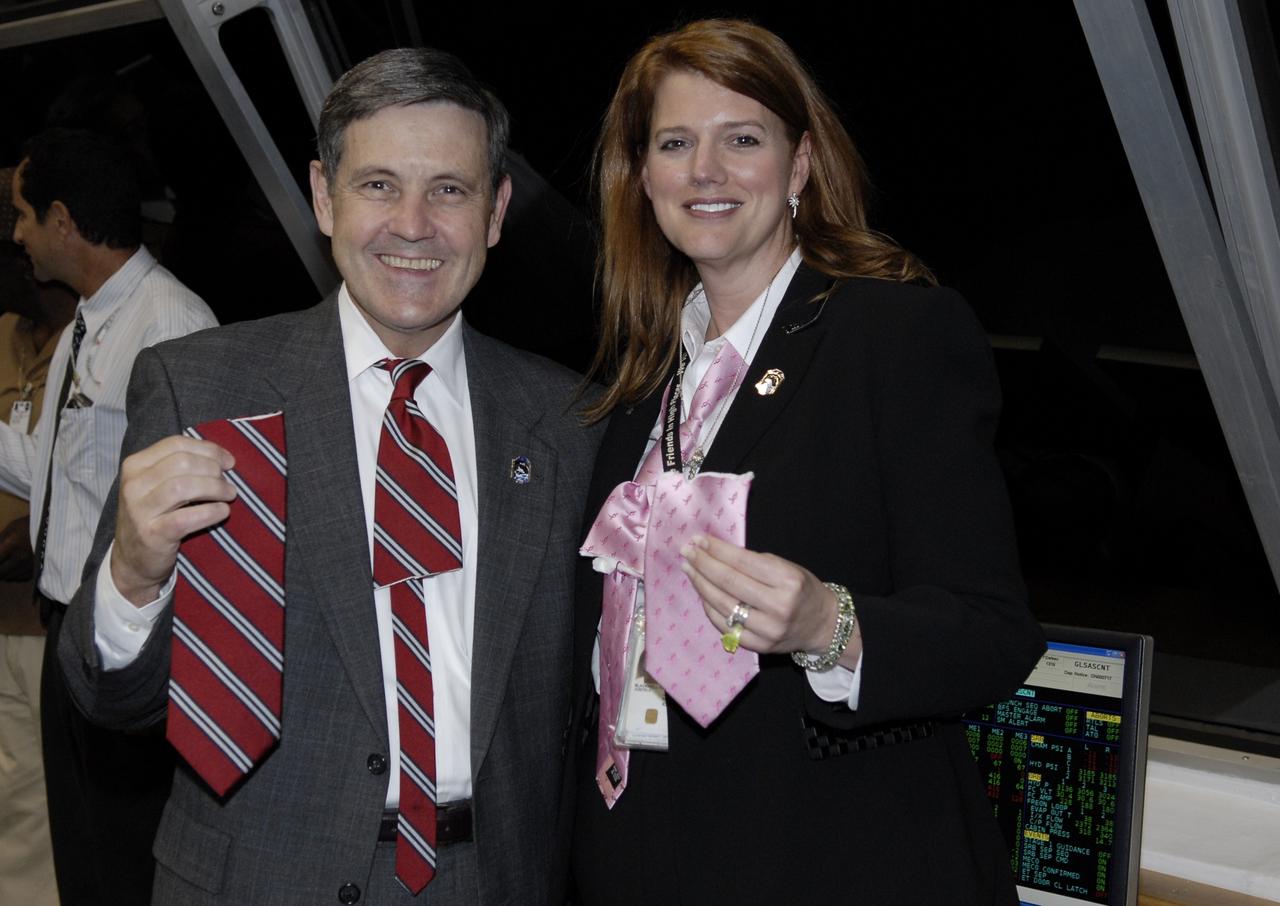 CAPE CANAVERAL, Fla. – After the successful launch of space shuttle Endeavour on the STS-126 mission at NASA's Kennedy Space Center in Florida, Center Director Bob Cabana and STS-126 NASA Test Director Charlie Blackwell-Thompson show off their newly clipped ties that signified their initiation experiencing their first shuttle launch.  Liftoff was on time at 7:55 p.m. EST.  STS-126 is the 124th space shuttle flight and the 27th flight to the International Space Station. The mission will feature four spacewalks and work that will prepare the space station to house six crew members for long-duration missions.  Photo credit: NASA/Kim Shiflett