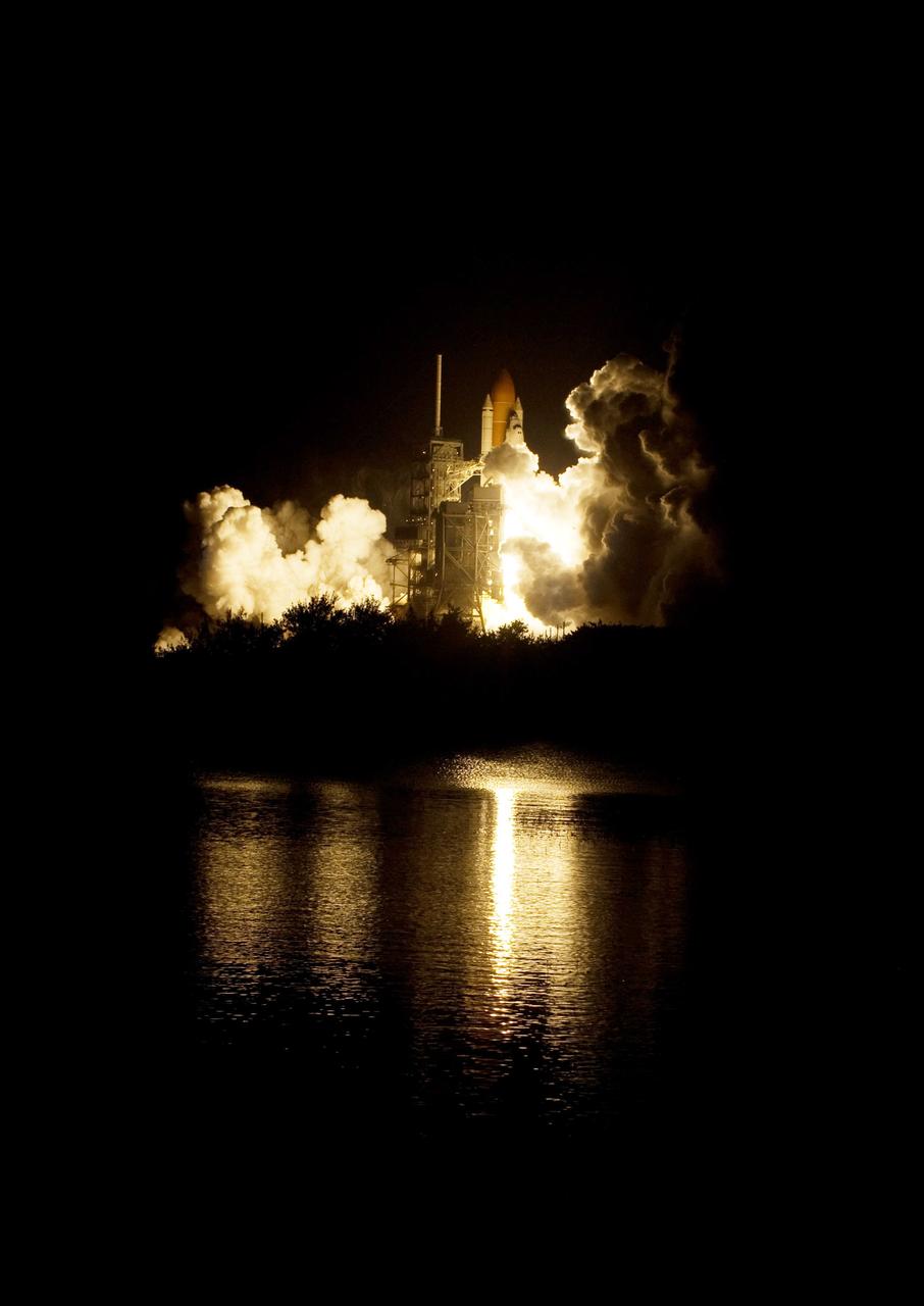 CAPE CANAVERAL, Fla. – The fiery glow from the liftoff of space shuttle Endeavour on the STS-126 mission fills the Launch Pad 39A and water nearby at NASA's Kennedy Space Center in Florida. Liftoff was on time at 7:55 p.m. EST. STS-126 is the 124th space shuttle flight and the 27th flight to the International Space Station. The mission will feature four spacewalks and work that will prepare the space station to house six crew members for long-duration missions. Photo credit: NASA/Tony Gray-Tom Farrar