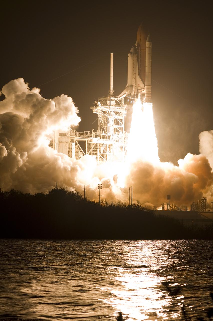CAPE CANAVERAL, Fla. – Atop twin towers of flame, space shuttle Endeavour races past the lightning mast on Launch Pad 39A at NASA's Kennedy Space Center in Florida, heading into space on the STS-126 mission. Liftoff was on time at 7:55 p.m. EST. STS-126 is the 124th space shuttle flight and the 27th flight to the International Space Station. The mission will feature four spacewalks and work that will prepare the space station to house six crew members for long-duration missions. Photo courtesy of Scott Andrews