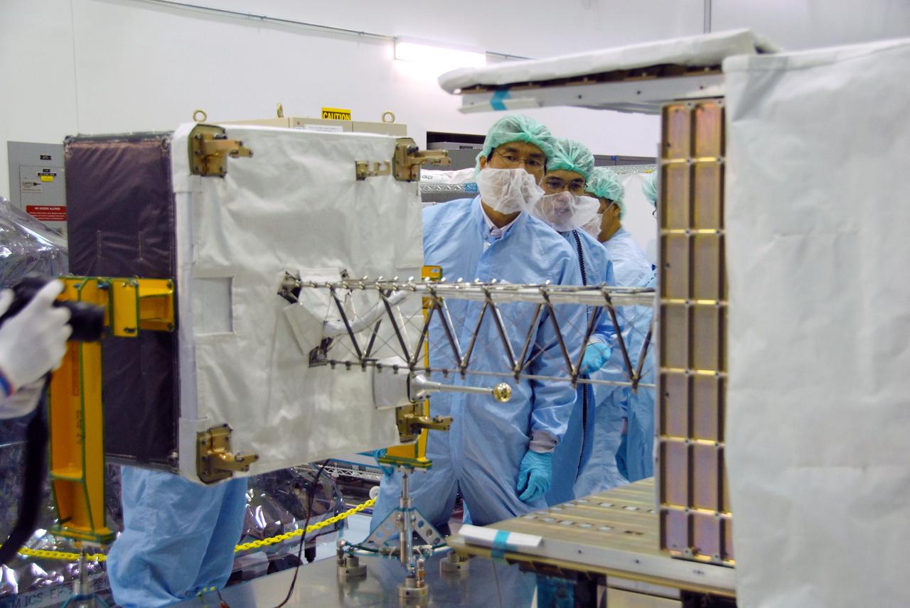 CAPE CANAVERAL, Fla. –  In the Space Station Processing Facility at NASA's Kennedy Space Center in Florida, workers check the mast deployment on the SEDA-AP or Space Environment Data Acquisition equipment--Attached Payload. SEDA-AP will measure space environment in ISS orbit and environmental effects on materials and electronic devices to investigate the interaction with and from the environment at the Kibo exposed facility. The payload will be installed on the Japanese Experiment Module's Experiment Logistics Module-Exposed Section, or ELM-ES. The ELM-ES is one of the final components of the Japan Aerospace Exploration Agency's Kibo laboratory for the International Space Station.  It can provide payload storage space and can carry up to three payloads at launch. In addition, the ELM-ES provides a logistics function where it can be returned to the ground aboard the space shuttle. The ELM-ES will be carried aboard space shuttle Endeavour on the STS-127 mission targeted for launch May 15.  Photo credit: NASA/Cory Huston
