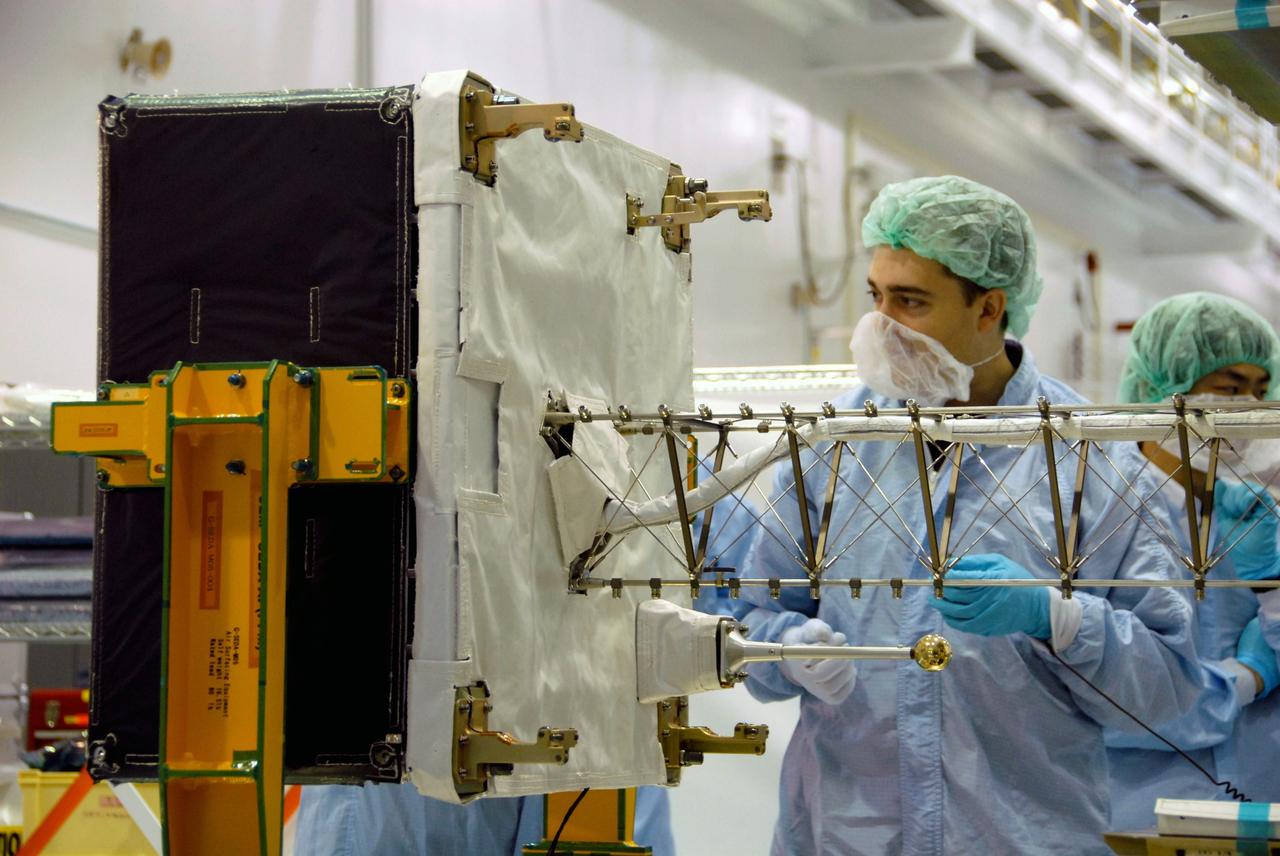 CAPE CANAVERAL, Fla. –  In the Space Station Processing Facility at NASA's Kennedy Space Center in Florida, workers check the mast deployment on the SEDA-AP or Space Environment Data Acquisition equipment--Attached Payload. SEDA-AP will measure space environment in ISS orbit and environmental effects on materials and electronic devices to investigate the interaction with and from the environment at the Kibo exposed facility. The payload will be installed on the Japanese Experiment Module's Experiment Logistics Module-Exposed Section, or ELM-ES. The ELM-ES is one of the final components of the Japan Aerospace Exploration Agency's Kibo laboratory for the International Space Station.  It can provide payload storage space and can carry up to three payloads at launch. In addition, the ELM-ES provides a logistics function where it can be returned to the ground aboard the space shuttle. The ELM-ES will be carried aboard space shuttle Endeavour on the STS-127 mission targeted for launch May 15.  Photo credit: NASA/Cory Huston