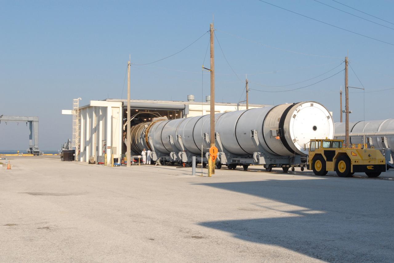 CAPE CANAVERAL, Fla. –  At Hangar AF at Cape Canaveral Air Force Station in Florida, two spent solid rocket boosters from space shuttle Endeavour, which launched Nov. 14 on the STS-126 mission, move into the hangar for inspection. The space shuttle’s solid rocket booster casings and associated flight hardware are recovered at sea after being jettisoned. The boosters impact the Atlantic Ocean approximately seven minutes after liftoff. After their recovery and transport to Hangar AF, the boosters are cleaned, inspected, disassembled, refurbished and reloaded with solid propellant for reuse.  Photo credit: NASA/Jim Grossmann