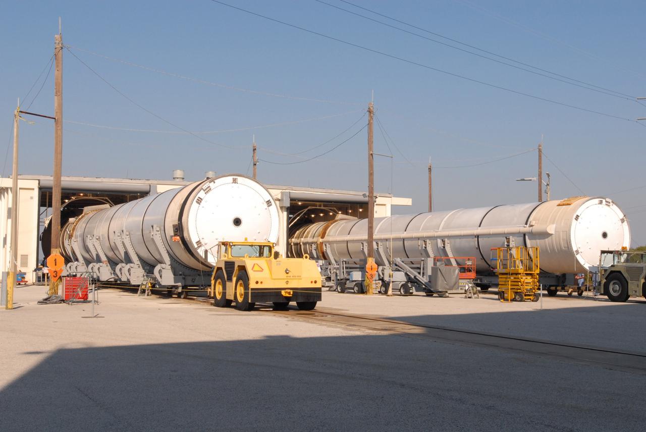 CAPE CANAVERAL, Fla. –    After inspection, the two spent solid rocket boosters from space shuttle Endeavour, which launched Nov. 14 on the STS-126 mission, leave Hangar AF at Cape Canaveral Air Force Station in Florida. The SRBs will be rinsed one more time and then moved inside the hangar, where they remain for the rest of the disassembly operations.  The space shuttle’s solid rocket booster casings and associated flight hardware are recovered at sea after being jettisoned. The boosters impact the Atlantic Ocean approximately seven minutes after liftoff. After their recovery and transport to Hangar AF, the boosters are cleaned, inspected, disassembled, refurbished and reloaded with solid propellant for reuse.  Photo credit: NASA/Jim Grossmann