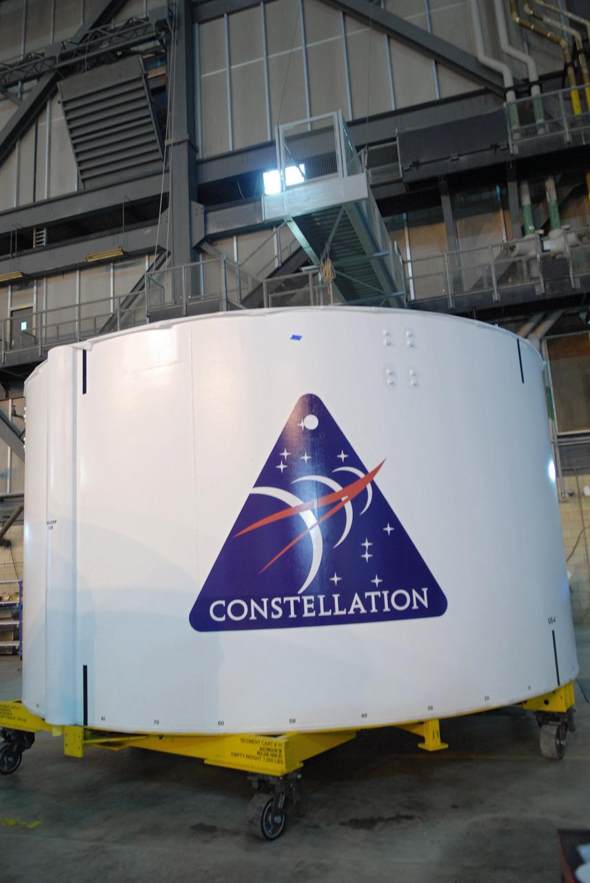 CAPE CANAVERAL, Fla. –   In the Vehicle Assembly Building high bay 4 at NASA's Kennedy Space Center in Florida, one of the Ares I-X upper stage simulator segments bears the Constellation patch. The upper stage simulator will be used in the test flight identified as Ares I-X in 2009.  Ares I-X is the test vehicle for the Ares I, which is part of the Constellation Program to return men to the moon and beyond.  Ares I is the essential core of a safe, reliable, cost-effective space transportation system that eventually will carry crewed missions back to the moon, on to Mars and out into the solar system. Ares I may also use its 25-ton payload capacity to deliver resources and supplies to the International Space Station, or to "park" payloads in orbit for retrieval by other spacecraft bound for the moon or other destinations.  Photo credit: NASA/Jack Pfaller