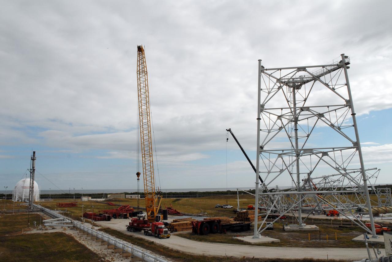 CAPE CANAVERAL, Fla. - On Launch Pad 39B at NASA’s Kennedy Space Center in Florida, the giant crane at left will be used to continue erecting the lightning towers at right. Each of the three new lightning towers will be 500 feet tall with an additional 100-foot fiberglass mast atop supporting a wire centenary system.  This improved lightning protection system allows for the taller height of the Ares I compared to the space shuttle.  Pad B will be the site of the first Ares vehicle launch, including Ares I-X which is targeted for summer of 2009, as part of NASA’s Constellation Program.  Photo credit: NASA/Tim Jacobs