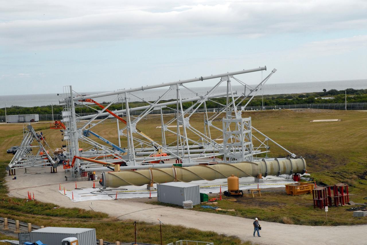 CAPE CANAVERAL, Fla. - On Launch Pad 39B at NASA’s Kennedy Space Center in Florida, one of the lightning towers under construction lies on its side. Each of the three new lightning towers will be 500 feet tall with an additional 100-foot fiberglass mast atop supporting a wire centenary system.  This improved lightning protection system allows for the taller height of the Ares I compared to the space shuttle.  Pad B will be the site of the first Ares vehicle launch, including Ares I-X which is targeted for summer of 2009, as part of NASA’s Constellation Program.  Photo credit: NASA/Tim Jacobs