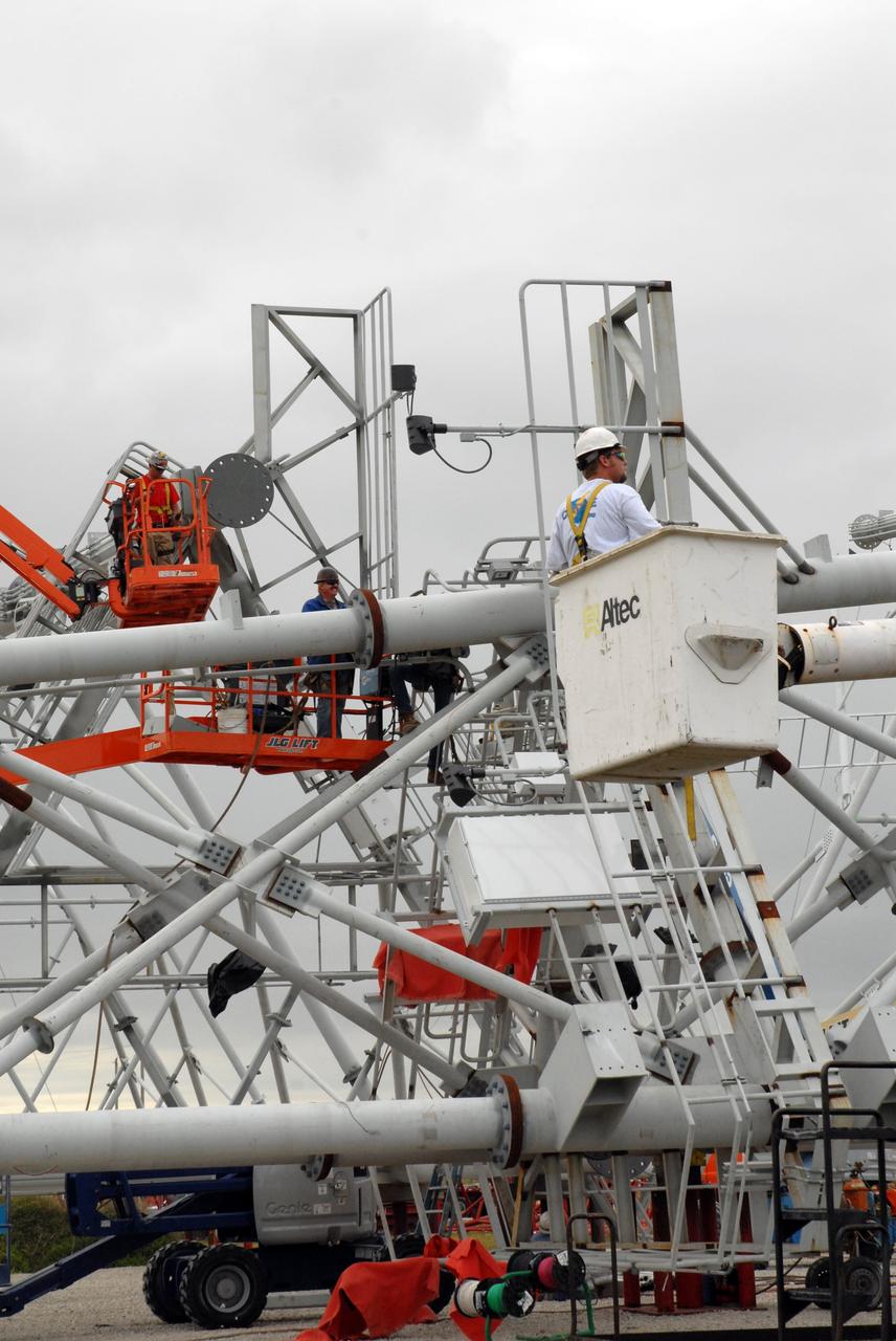 CAPE CANAVERAL, Fla. - The new lightning towers are under construction on Launch Pad 39B at NASA’s Kennedy Space Center in Florida. Each of the three new lightning towers will be 500 feet tall with an additional 100-foot fiberglass mast atop supporting a wire centenary system.  This improved lightning protection system allows for the taller height of the Ares I compared to the space shuttle.  Pad B will be the site of the first Ares vehicle launch, including Ares I-X which is targeted for summer of 2009, as part of NASA’s Constellation Program.  Photo credit: NASA/Tim Jacobs