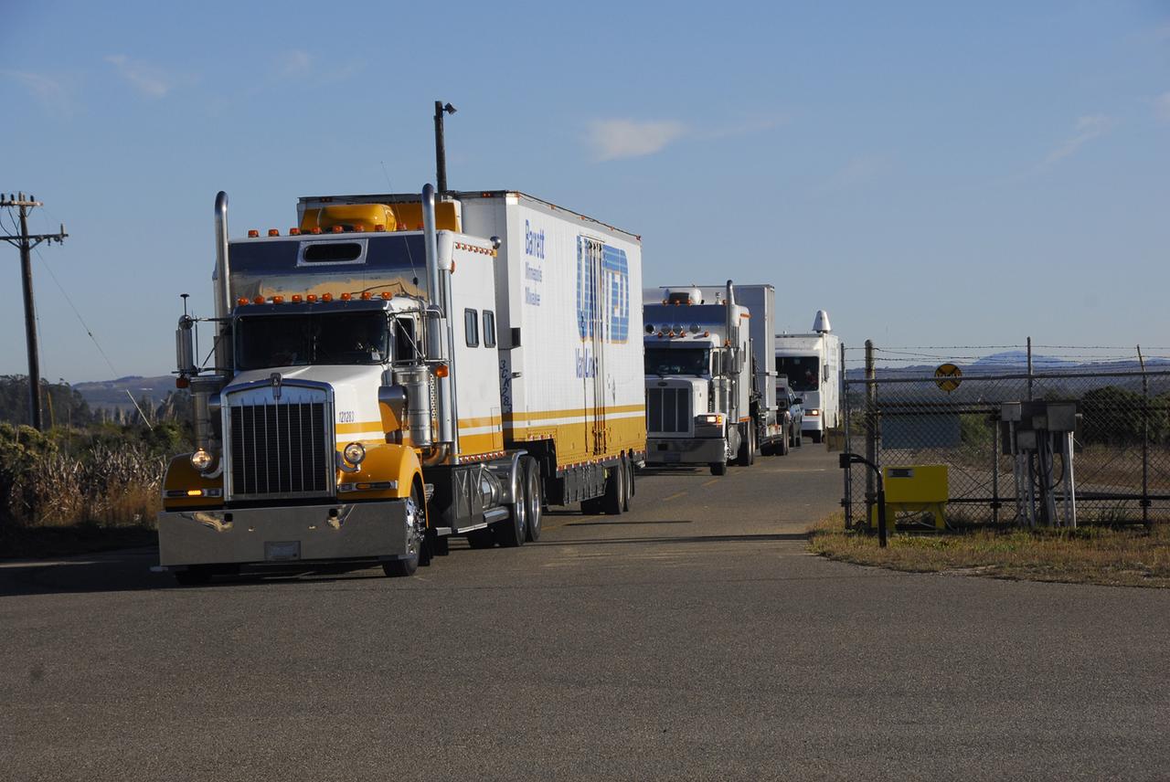 VANDENBERG AIR FORCE BASE, Calif. -- Trucks roll onto Vandenberg Air Force Base in California to deliver the Orbiting Carbon Observatory, or OCO, spacecraft, shipped from spacecraft facilities in Dulles, Va., by Orbital Sciences, builder of the spacecraft. The observatory will be taken to Astrotech payload processing facility, building 1032. After the protective coverings over the spacecraft are removed, blanket preparations and edge taping will be done, followed by mechanical preparations and work on the electronic ground support equipment. The OCO is a new Earth-orbiting mission sponsored by NASA's Earth System Science Pathfinder Program. The observatory is targeted to launch Jan. 15 from Space Launch Complex 576-E at Vandenberg. Photo credit: NASA/Robert Hargreaves Jr., VAFB