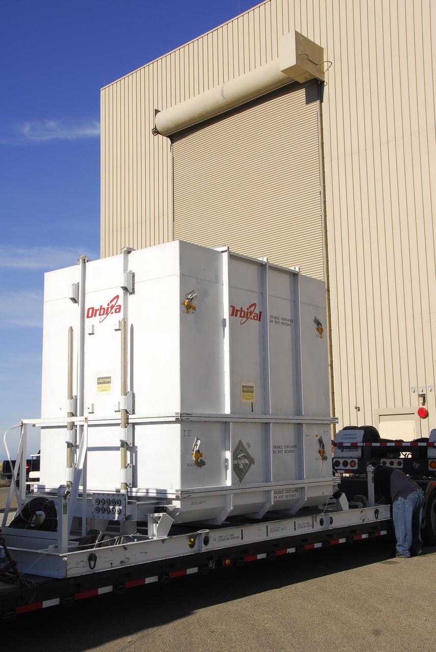 VANDENBERG AIR FORCE BASE, Calif. -- The Orbiting Carbon Observatory, or OCO, spacecraft, shipped from spacecraft facilities in Dulles, Va., by Orbital Sciences, arrives at the Astrotech payload processing facility, building 1032, at Vandenberg Air Force Base in California. After the protective coverings over the spacecraft are removed, blanket preparations and edge taping will be done, followed by mechanical preparations and work on the electronic ground support equipment. The OCO is a new Earth-orbiting mission sponsored by NASA's Earth System Science Pathfinder Program. The observatory is targeted to launch Jan. 15 from Space Launch Complex 576-E at Vandenberg. Photo credit: NASA/Robert Hargreaves Jr., VAFB