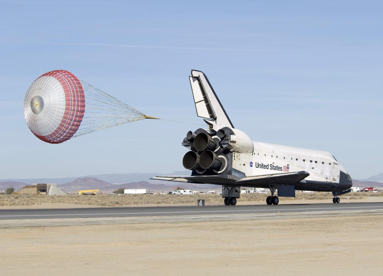 EDWARDS, Calif. –-  A drag chute slows the speed of space shuttle Endeavour as it lands at Edwards Air Force Base in California after touching down at 4:25 p.m. EST to end the STS-126 mission, completing its 16-day journey of over 6.6 million miles in space. The main landing gear touched down at 4:25:06 p.m. EST. The nose landing gear touched down at 4:25:21 p.m. and wheel stop was at 4:26:03 p.m. The STS-126 mission was the 27th flight to the International Space Station, carrying equipment and supplies in the Multi-Purpose Logistics Module Leonardo. The mission featured four spacewalks and work to prepare the space station to house six crew members for long-duration missions.  Photo credit: NASA/ Tony Landis, EAFB