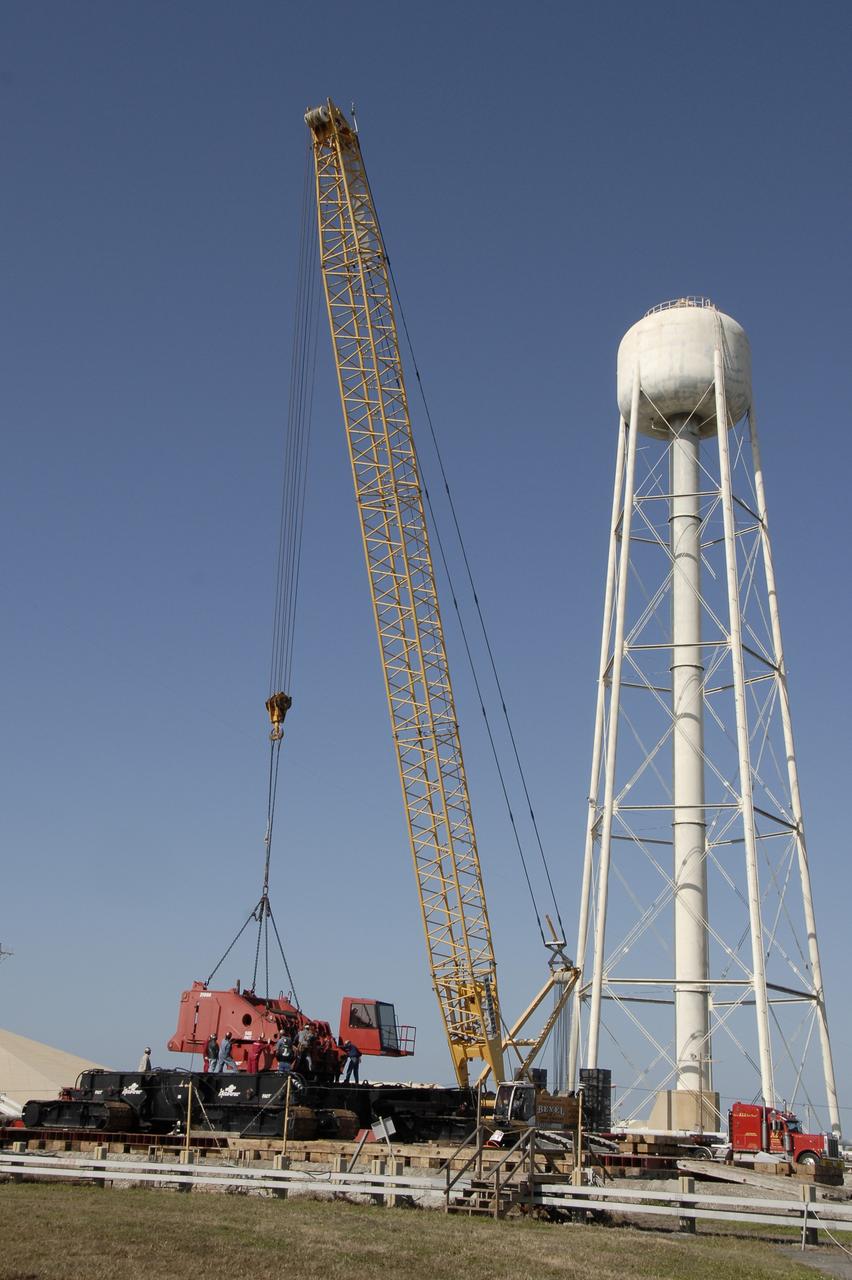 CAPE CANAVERAL, Fla. --  On Launch Pad 39B at NASA’s Kennedy Space Center in Florida, the giant crane moves equipment that will be used to continue erecting the lightning towers. Each of the three new lightning towers will be 500 feet tall with an additional 100-foot fiberglass mast atop supporting a wire catenary system. This improved lightning protection system allows for the taller height of the Ares I compared to the space shuttle. Pad B will be the site of the first Ares vehicle launch, including Ares I-X which is targeted for summer of 2009, as part of NASA’s Constellation Program. Photo credit: NASA/Kim Shiflett