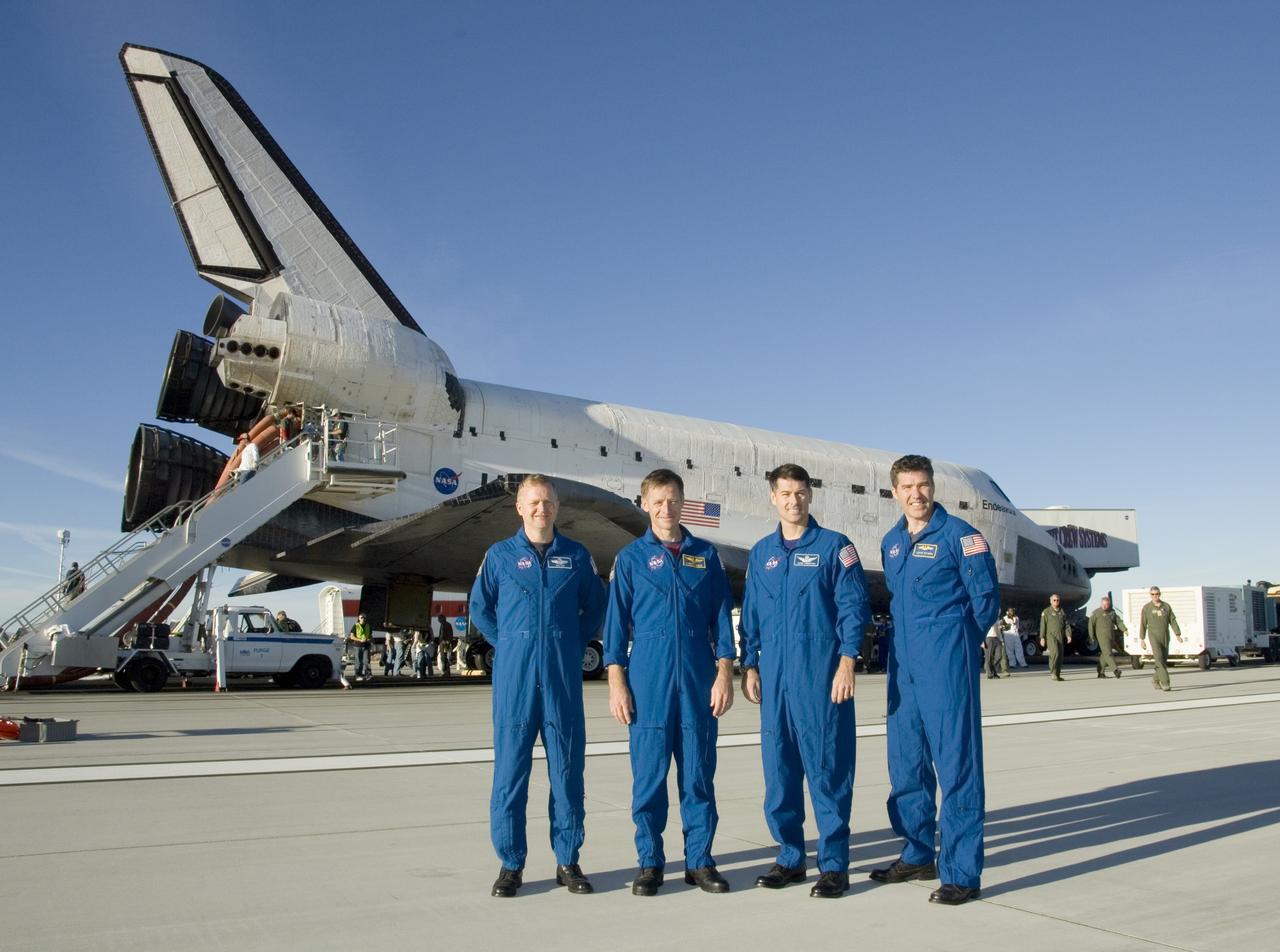 EDWARDS, Calif. – After space shuttle Endeavour's landing at Edwards Air Force Base in California, four of the STS-126 crew members pose for the media.  From left are Pilot Eric Boe, Commander Chris Ferguson and Mission Specialists Shane Kimbrough and Steve Bowen. The decision to land at Edwards was made due to weather concerns at NASA's Kennedy Space Center in Florida.  In the 52nd landing at Edwards, Endeavour touched down at 4:25 p.m. EST to end the STS-126 mission, completing its 16-day journey of over 6.6 million miles in space. The STS-126 mission was the 27th flight to the International Space Station, carrying equipment and supplies in the Multi-Purpose Logistics Module Leonardo. The mission featured four spacewalks and work to prepare the space station to house six crew members for long-duration missions.   Photo credit: NASA/Tom Tschida, VAFB