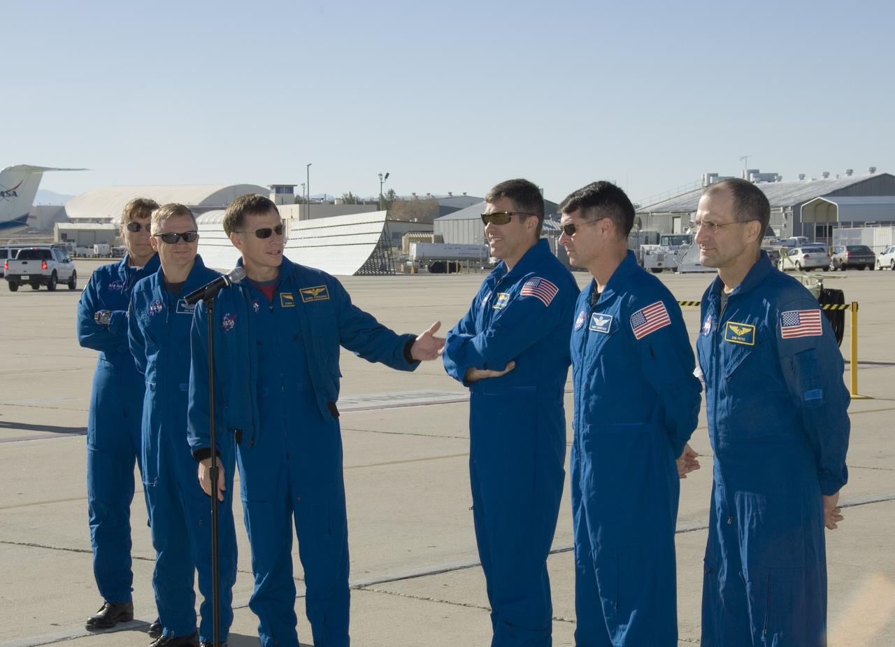 EDWARDS, Calif. – At Edwards Air Force Base in California, STS-126 crew members talk to the media before their departure for NASA's Johnson Space Center in Houston. From left are Mission Specialist Heidemarie Stefanyshyn-Piper, Pilot Eric Boe, Commander Chris Ferguson and Mission Specialists Steve Bowen, Shane Kimbrough and Donald Pettit. The decision to land space shuttle Endeavour at Edwards was made due to weather concerns at NASA's Kennedy Space Center in Florida. In the 52nd landing at Edwards, Endeavour touched down at 4:25 p.m. EST on Nov. 30 to end the STS-126 mission, completing its 16-day journey of over 6.6 million miles in space. The STS-126 mission was the 27th flight to the International Space Station, carrying equipment and supplies in the Multi-Purpose Logistics Module Leonardo. The mission featured four spacewalks and work to prepare the space station to house six crew members for long-duration missions. Photo credit: NASA/Tony Landis, VAFB