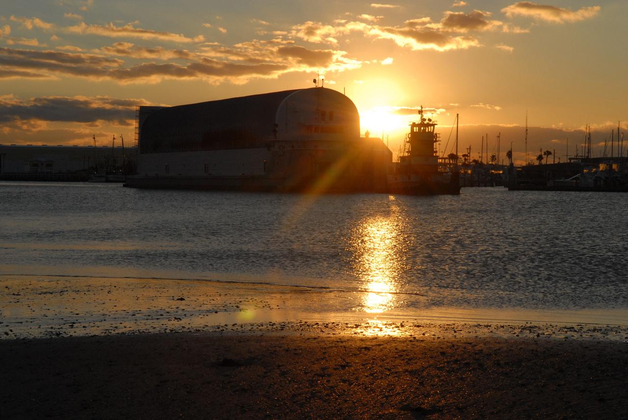 CAPE CANAVERAL, Fla. -- The Pegasus barge carrying external tank 130 arrives at Port Canaveral in Florida after an ocean voyage towed by a solid rocket booster retrieval ship from NASA's Michoud Assembly Facility near New Orleans. Pegasus will continue up the Banana River to the turn basin near the Vehicle Assembly Building, or VAB, at NASA's Kennedy Space Center in Florida. After the Pegasus docks, the fuel tank will be offloaded and transported to the VAB. External tank 130 is the one designated for space shuttle Endeavour on the STS-127 mission targeted for launch on May 15. Photo credit: NASA/Troy Cryder