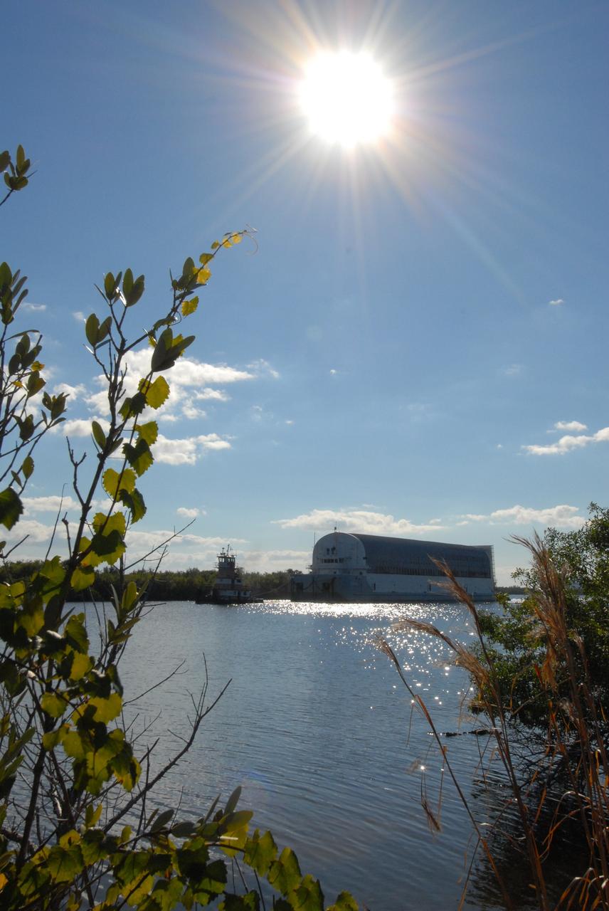 CAPE CANAVERAL, Fla. -- A bright sun and blue sky herald the passage of the Pegasus barge through the Banana River toward the turn basin near the Vehicle Assembly Building, or VAB, at NASA's Kennedy Space Center in Florida. Pegasus, carrying external tank 130, arrived in Florida after an ocean voyage towed by a solid rocket booster retrieval ship from NASA's Michoud Assembly Facility near New Orleans. After the Pegasus docks, the fuel tank will be offloaded and transported to the VAB. External tank 130 is the one designated for space shuttle Endeavour on the STS-127 mission targeted for launch on May 15. Photo credit: NASA/Troy Cryder