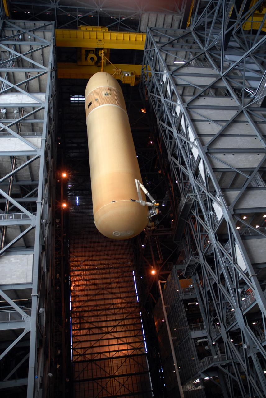 CAPE CANAVERAL, Fla. --  Suspended by a crane in the Vehicle Assembly Building at NASA's Kennedy Space Center in Florida, external fuel tank 130 is moved into high bay 2 for checkout before stacking with the solid rocket boosters and space shuttle Atlantis  for the STS-125 mission. The fuel tank was previously designated for the STS-127 mission. The STS-125 Hubble servicing mission  is targeted to launch May 12.  Photo credit: NASA/Tim Jacobs