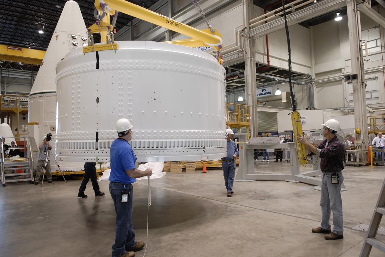 CAPE CANAVERAL, Fla. -- In the Assembly and Refurbishment Facility at NASA's Kennedy Space Center in Florida, the forward skirt extension of the Ares I-X first stage is moved. The extension will house new, larger parachutes. The three main parachutes each have a 150-foot diameter, compared to the shuttle booster main parachutes, which are 136 feet across. Photo credit: NASA/Kim Shiflett