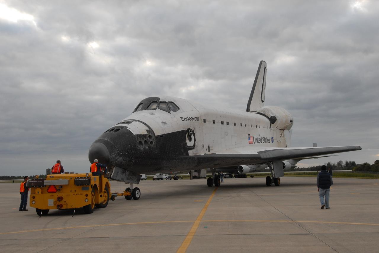 CAPE CANAVERAL, Fla. --   At the Shuttle Landing Facility at NASA's Kennedy Space Center in Florida, space shuttle Endeavour is attached to a diesel-powered tractor to be towed to the Orbiter Processing Facility, or OPF.  After landing in California to end the STS-126 mission, Endeavour returned to Kennedy on a piggyback flight atop a shuttle carrier aircraft.  In the OPF, Endeavour will begin preparations for its next mission, STS-127, targeted for May 2009. Photo credit: NASA/Jack Pfaller