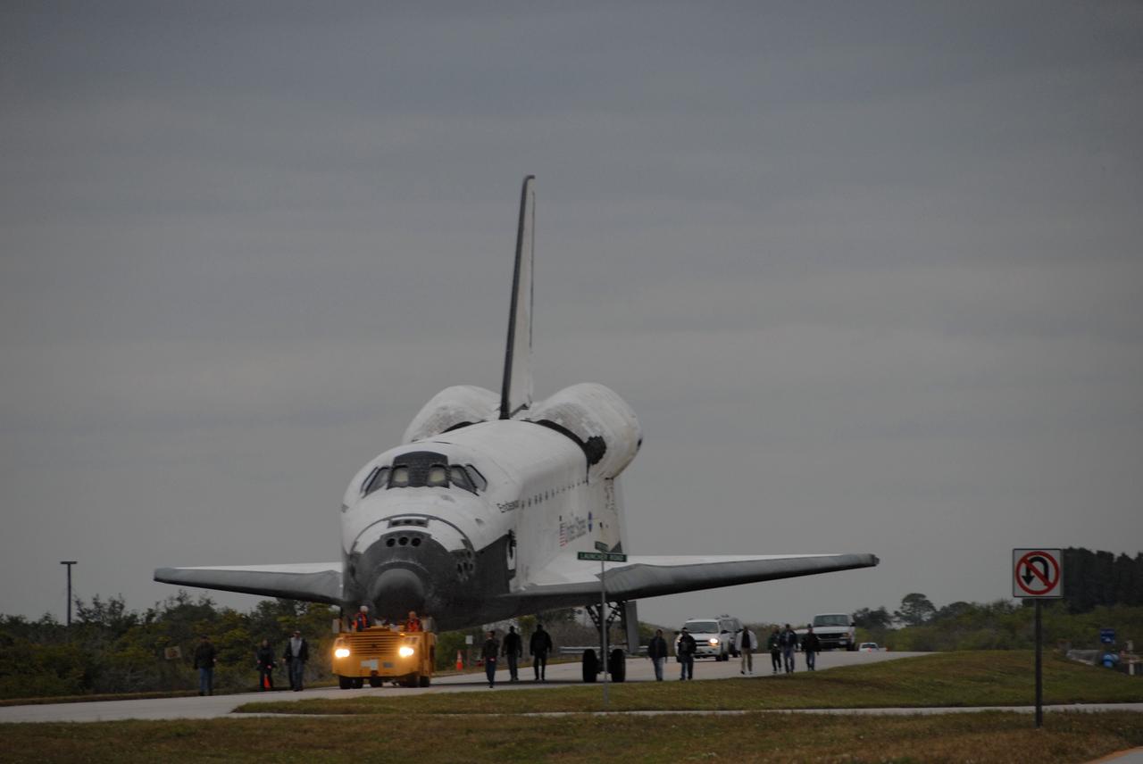 CAPE CANAVERAL, Fla. --   Attached to a diesel-powered tractor, space shuttle Endeavour is towed from the Shuttle Landing Facility at NASA's Kennedy Space Center in Florida to the Orbiter Processing Facility, or OPF. After landing in California to end the STS-126 mission, Endeavour returned to Kennedy on a piggyback flight atop a shuttle carrier aircraft.  In the OPF, Endeavour will begin preparations for its next mission, STS-127, targeted for May 2009. Photo credit: NASA/Jack Pfaller
