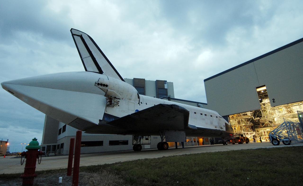 CAPE CANAVERAL, Fla. --  Space shuttle Endeavour is towed by a diesel-powered tractor toward the Orbiter Processing Facility, or OPF, at NASA's Kennedy Space Center in Florida.  After landing in California to end the STS-126 mission, Endeavour returned to Kennedy on a piggyback flight atop a shuttle carrier aircraft.  In the OPF, Endeavour will begin preparations for its next mission, STS-127, targeted for May 2009. Photo credit: NASA/Jack Pfaller