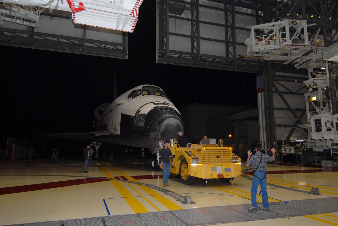 CAPE CANAVERAL, Fla. --  Space shuttle Endeavour is towed by a diesel-powered tractor into the Orbiter Processing Facility, or OPF, at NASA's Kennedy Space Center in Florida.  After landing in California to end the STS-126 mission, Endeavour returned to Kennedy on a piggyback flight atop a shuttle carrier aircraft.  In the OPF, Endeavour will begin preparations for its next mission, STS-127, targeted for May 2009. Photo credit: NASA/Jack Pfaller
