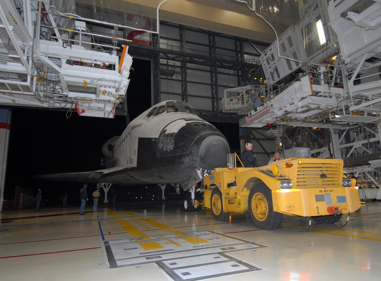 CAPE CANAVERAL, Fla. --  Space shuttle Endeavour is towed by a diesel-powered tractor into the Orbiter Processing Facility, or OPF, at NASA's Kennedy Space Center in Florida.  After landing in California to end the STS-126 mission, Endeavour returned to Kennedy on a piggyback flight atop a shuttle carrier aircraft.  In the OPF, Endeavour will begin preparations for its next mission, STS-127, targeted for May 2009. Photo credit: NASA/Jack Pfaller