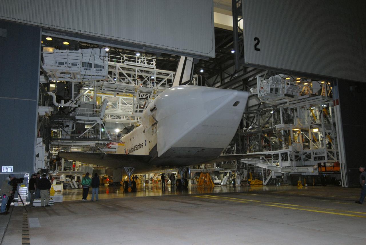 CAPE CANAVERAL, Fla. --  Space shuttle Endeavour is towed by a diesel-powered tractor into the Orbiter Processing Facility, or OPF, at NASA's Kennedy Space Center in Florida.  Visible on Endeavour is the tail cone that covers and protects the main engines during the ferry flight. After landing in California to end the STS-126 mission, Endeavour returned to Kennedy on a piggyback flight atop a shuttle carrier aircraft.  In the OPF, Endeavour will begin preparations for its next mission, STS-127, targeted for May 2009. Photo credit: NASA/Jack Pfaller