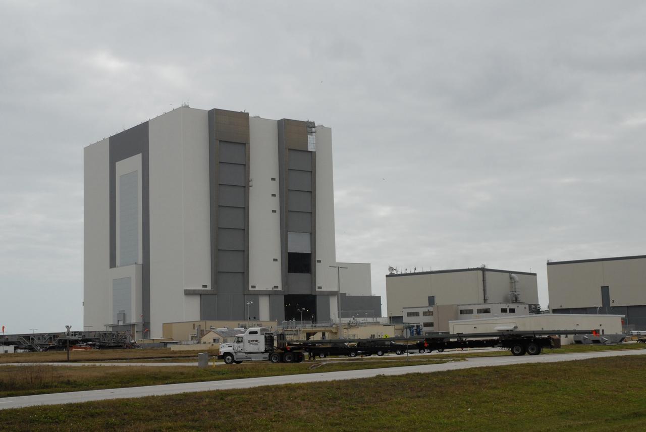 CAPE CANAVERAL, Fla. --   The mobile launcher truss, T4, arrives at NASA's Kennedy Space Center in Florida. It will be used to build the new mobile launcher for the Constellation Program.  The new mobile launcher will be the base for the Ares rockets to launch the Orion crew exploration vehicle and the cargo vehicle.  The base is being made lighter than space shuttle mobile launcher platforms so the crawler-transporter can pick up the added load of the 345-foot tower and taller rocket.  When the structural portion of the new mobile launcher is complete, umbilicals, access arms, communications equipment and command/control equipment will be installed. Photo credit: NASA/Jack Pfaller