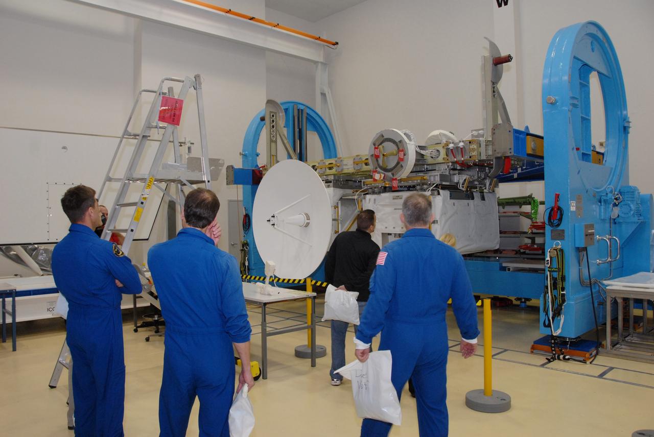 CAPE CANAVERAL, Fla. -- At SPACEHAB in Titusville, Fla., STS-127 crew members look at the SGANT (Space to Ground Antenna) at left and the pump module assembly at right, all attached to the Integrated Cargo Carrier-VLD (Vertical Light Deployment), part of the payload for the mission. The crew members are at Kennedy for a crew equipment interface test, or CEIT, which provides experience handling tools, equipment and hardware they will use on the mission. The payload will be launched to the International Space Station aboard space shuttle Endeavour on the STS-127 mission, targeted for launch on May 15, 2009. Photo credit: NASA/Dimitrios Gerondidakis