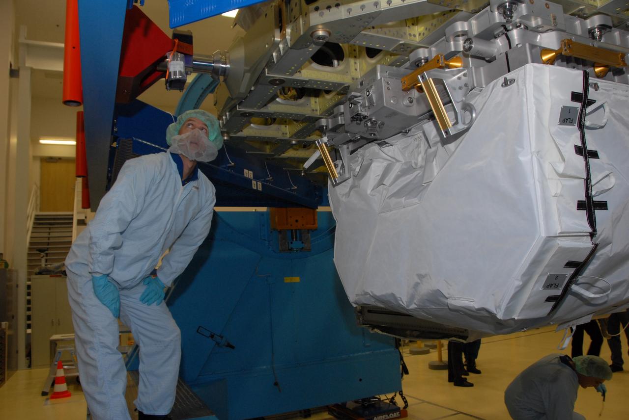 CAPE CANAVERAL, Fla. -- At SPACEHAB in Titusville, Fla., a STS-127 crew member looks at the Integrated Cargo Carrier-VLD (Vertical Light Deployment) with the LDU (Linear Drive Unit) at right, part of the payload for the mission. The crew members are at Kennedy for a crew equipment interface test, or CEIT, which provides experience handling tools, equipment and hardware they will use on the mission. The payload will be launched to the International Space Station aboard space shuttle Endeavour on the STS-127 mission, targeted for launch on May 15, 2009. Photo credit: NASA/Dimitrios Gerondidakis