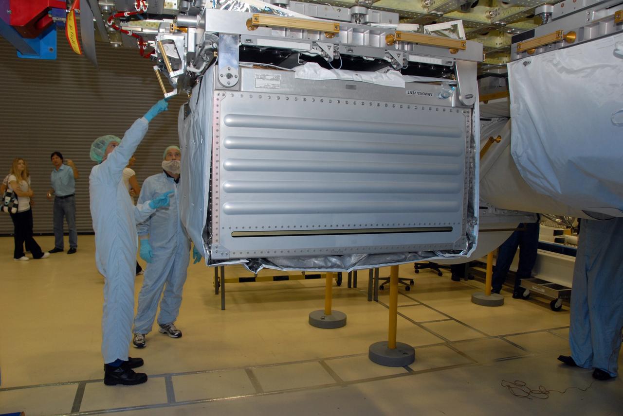 CAPE CANAVERAL, Fla. -- At SPACEHAB in Titusville, Fla., STS-127 crew members look at the Pump Module Assembly on the Integrated Cargo Carrier-VLD (Vertical Light Deployment), part of the payload for the mission. At right is the LDU (Linear Drive Unit). The crew members are at Kennedy for a crew equipment interface test, or CEIT, which provides experience handling tools, equipment and hardware they will use on the mission. The payload will be launched to the International Space Station aboard space shuttle Endeavour on the STS-127 mission, targeted for launch on May 15, 2009. Photo credit: NASA/Dimitrios Gerondidakis