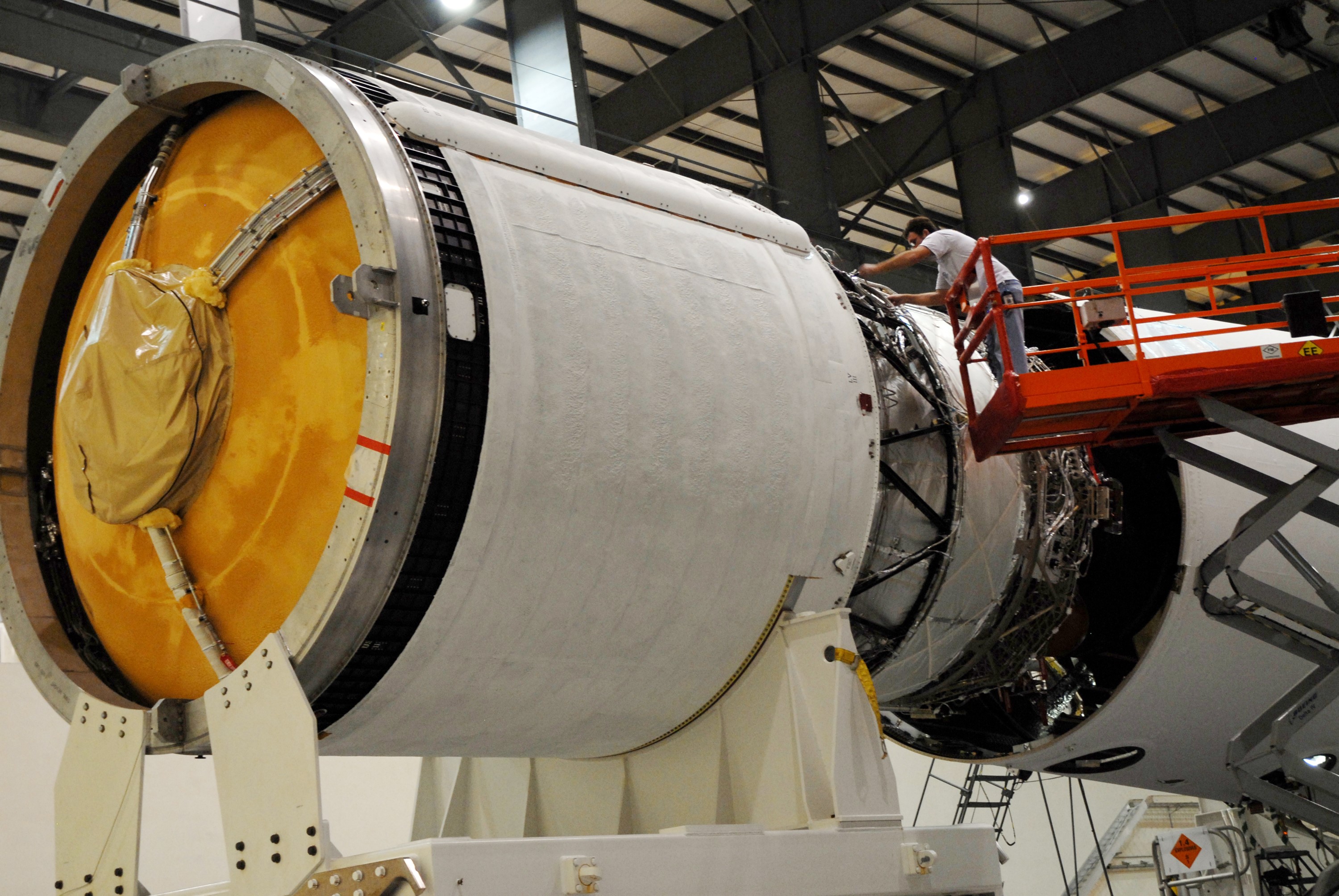 CAPE CANAVERAL, Fla. --  The GOES-O/Delta IV second stage is being mated to the first stage in the Horizontal Integration Facility on Complex 37 at Cape Canaveral Air Force Station in Florida. GOES–O is one of a series of Geostationary Operational Environmental Satellites. The multi-mission GOES series N-P will be a vital contributor to weather, solar and space operations and science. NASA and the National Oceanic and Atmospheric Administration, or NOAA, are actively engaged in a cooperative program to expand the existing GOES system with the launch of the GOES N-P satellites.  Launch of the GOES-O is targeted for no earlier than April 2009.  Photo credit: NASA/Jack Pfaller