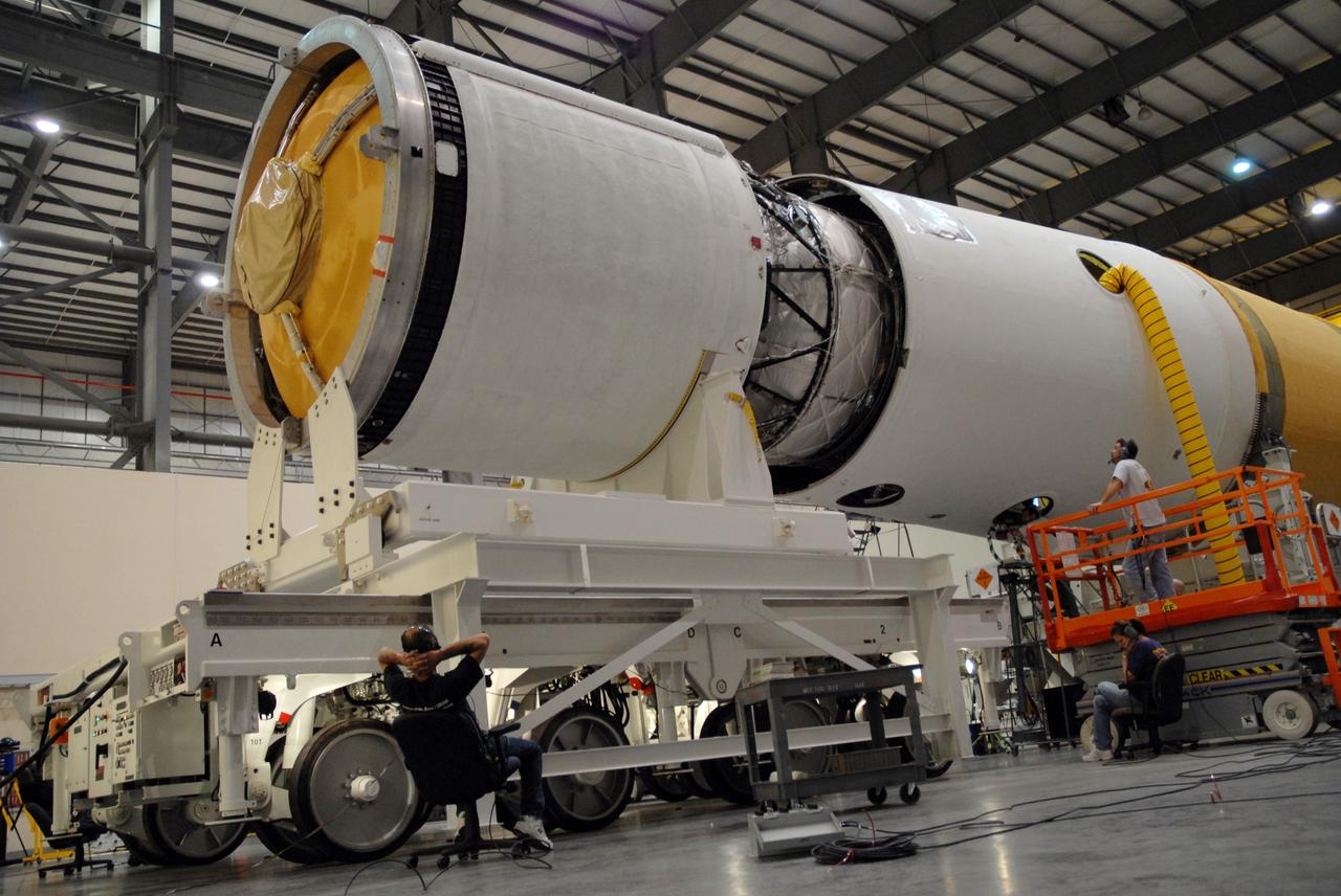 CAPE CANAVERAL, Fla. --  The GOES-O/Delta IV second stage is being mated to the first stage in the Horizontal Integration Facility on Complex 37 at Cape Canaveral Air Force Station in Florida. GOES–O is one of a series of Geostationary Operational Environmental Satellites. The multi-mission GOES series N-P will be a vital contributor to weather, solar and space operations and science. NASA and the National Oceanic and Atmospheric Administration, or NOAA, are actively engaged in a cooperative program to expand the existing GOES system with the launch of the GOES N-P satellites.  Launch of the GOES-O is targeted for no earlier than April 2009.  Photo credit: NASA/Jack Pfaller