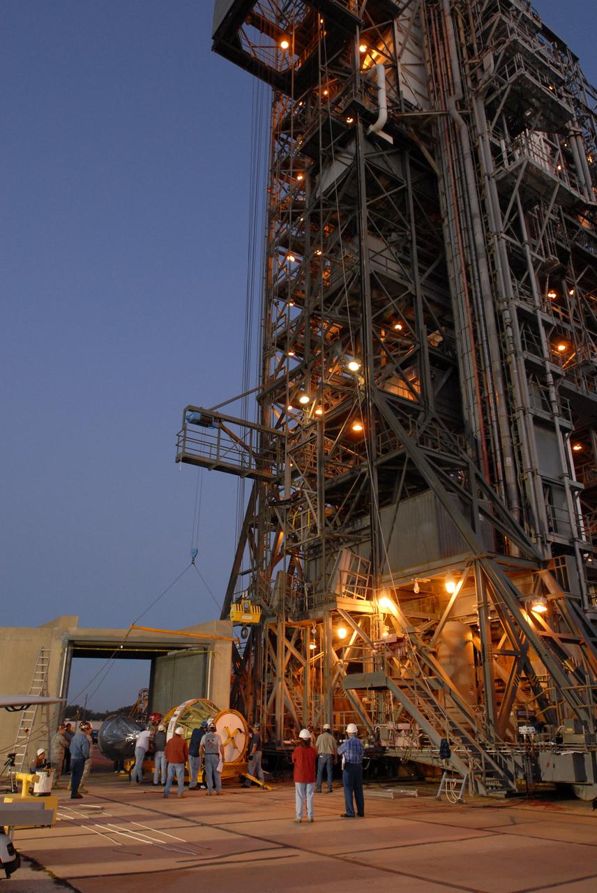 CAPE CANAVERAL, Fla. -- On Complex 17-B at Cape Canaveral Air Force Station in Florida, a crane is lowered toward the second stage of the Delta 2 rocket. Once attached to the second stage, the crane will lift it into the mobile service tower for mating with the first stage. The Delta 2 rocket is the launch vehicle for NASA's Kepler spacecraft. The Kepler mission is specifically designed to survey our region of the Milky Way galaxy to discover hundreds of Earth-size and smaller planets in or near the habitable zone and determine how many of the billions of stars in our galaxy have such planets. Results from this mission will allow us to place our solar system within the continuum of planetary systems in the Galaxy. NASA's planet-hunting Kepler mission is scheduled to launch no earlier than March 5, 2009. Photo credit: NASA/Jim Grossmann