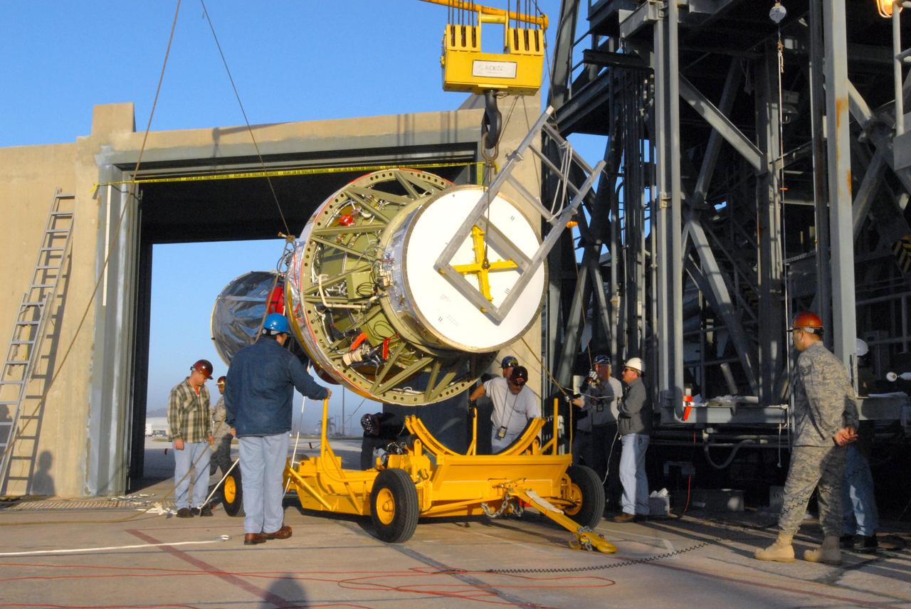 CAPE CANAVERAL, Fla. -- On Complex 17-B at Cape Canaveral Air Force Station in Florida, a crane lifts the second stage of the Delta 2 rocket off its transporter. The second stage will be lifted into the mobile service tower for mating with the first stage of the Delta 2, which is the launch vehicle for NASA's Kepler spacecraft. The Kepler mission is specifically designed to survey our region of the Milky Way galaxy to discover hundreds of Earth-size and smaller planets in or near the habitable zone and determine how many of the billions of stars in our galaxy have such planets. Results from this mission will allow us to place our solar system within the continuum of planetary systems in the Galaxy. NASA's planet-hunting Kepler mission is scheduled to launch no earlier than March 5, 2009. Photo credit: NASA/Jim Grossmann
