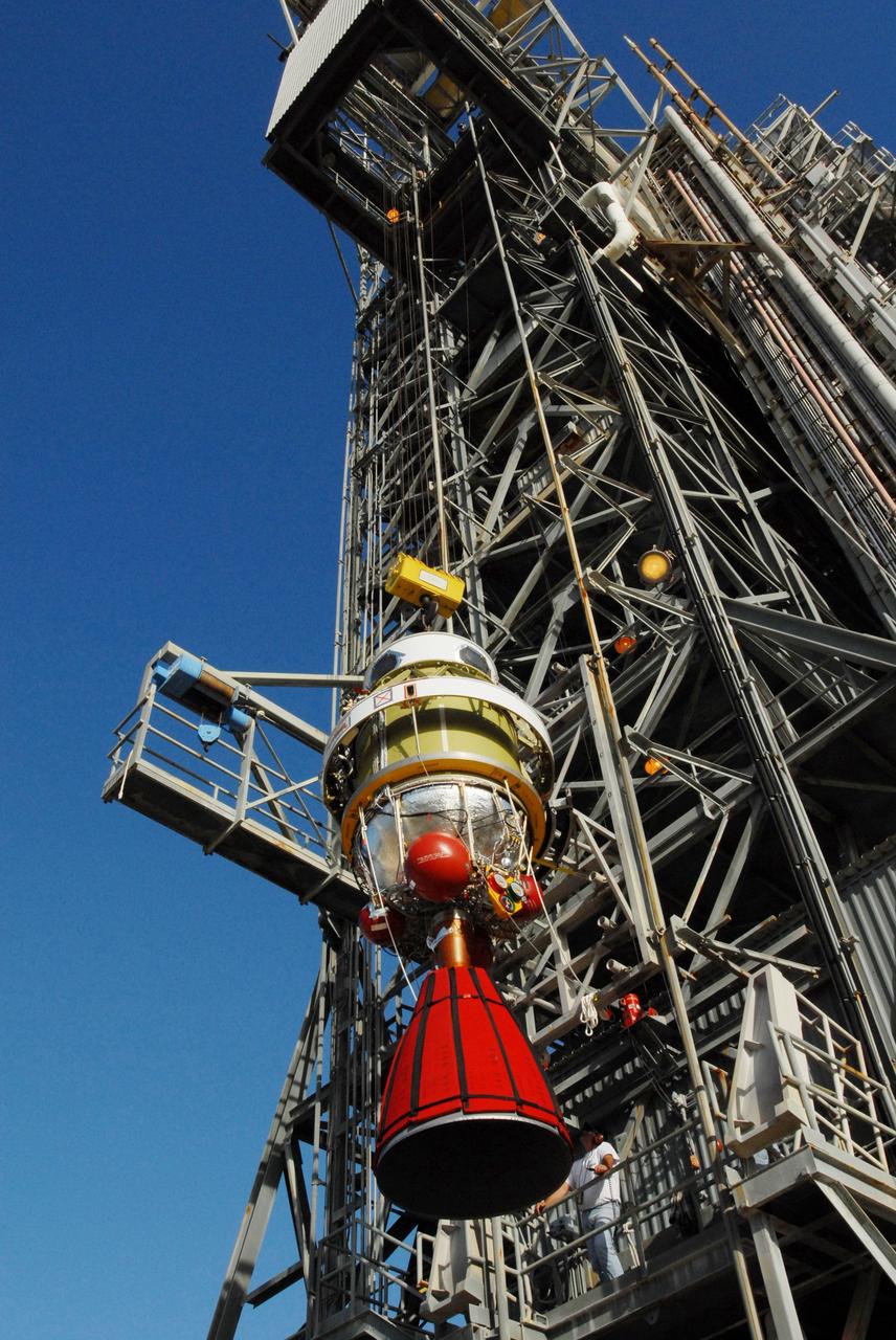 CAPE CANAVERAL, Fla. -- On Complex 17-B at Cape Canaveral Air Force Station in Florida, the second stage of the Delta 2 rocket for the launch of NASA's Kepler spacecraft is lifted alongside the mobile service tower. In the tower, the second stage will be mated to the first stage of the Delta 2. The Kepler mission is specifically designed to survey our region of the Milky Way galaxy to discover hundreds of Earth-size and smaller planets in or near the habitable zone and determine how many of the billions of stars in our galaxy have such planets. Results from this mission will allow us to place our solar system within the continuum of planetary systems in the Galaxy. NASA's planet-hunting Kepler mission is scheduled to launch no earlier than March 5, 2009. Photo credit: NASA/Jim Grossmann