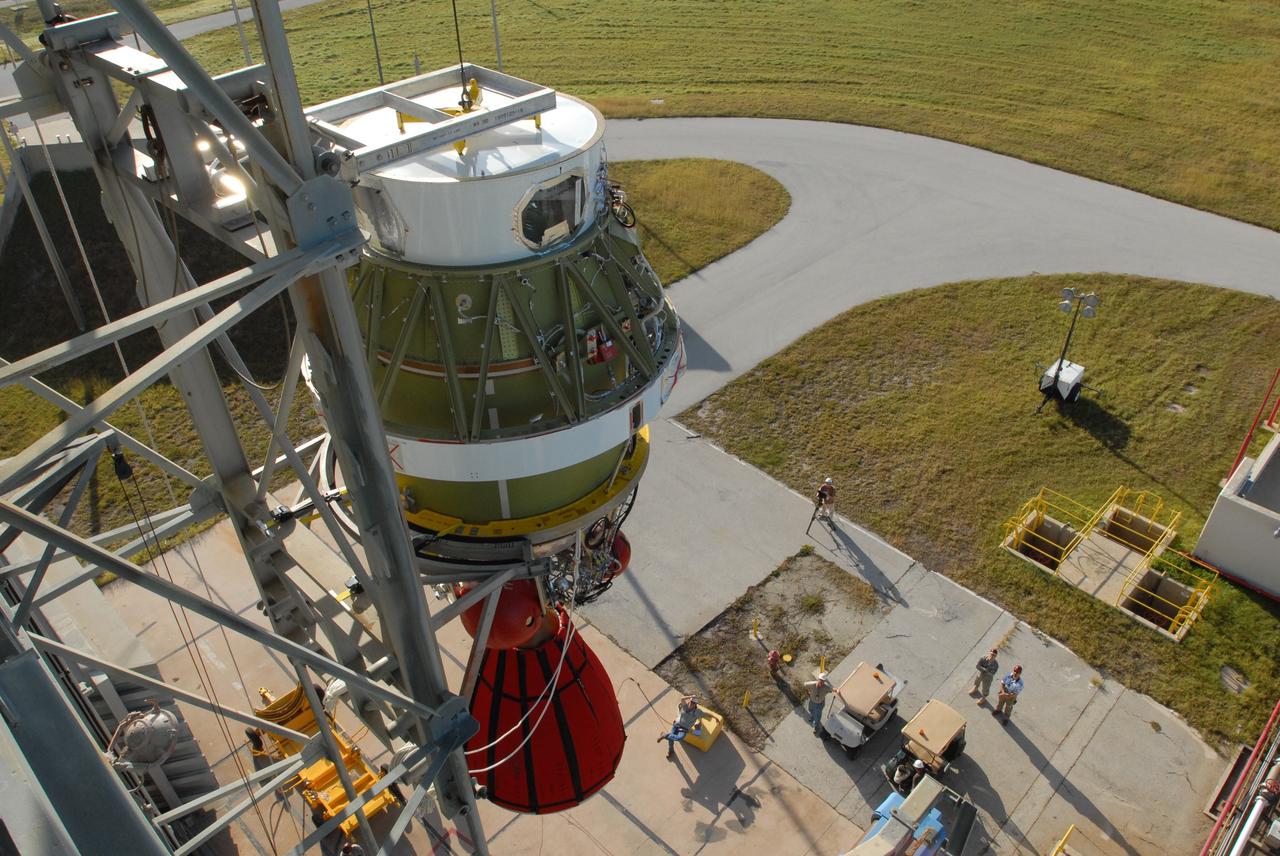 CAPE CANAVERAL, Fla. -- On Complex 17-B at Cape Canaveral Air Force Station in Florida, the second stage of the Delta 2 rocket for the launch of NASA's Kepler spacecraft is lifted alongside the mobile service tower. In the tower, the second stage will be mated to the first stage of the Delta 2. The Kepler mission is specifically designed to survey our region of the Milky Way galaxy to discover hundreds of Earth-size and smaller planets in or near the habitable zone and determine how many of the billions of stars in our galaxy have such planets. Results from this mission will allow us to place our solar system within the continuum of planetary systems in the Galaxy. NASA's planet-hunting Kepler mission is scheduled to launch no earlier than March 5, 2009. Photo credit: NASA/Jim Grossmann