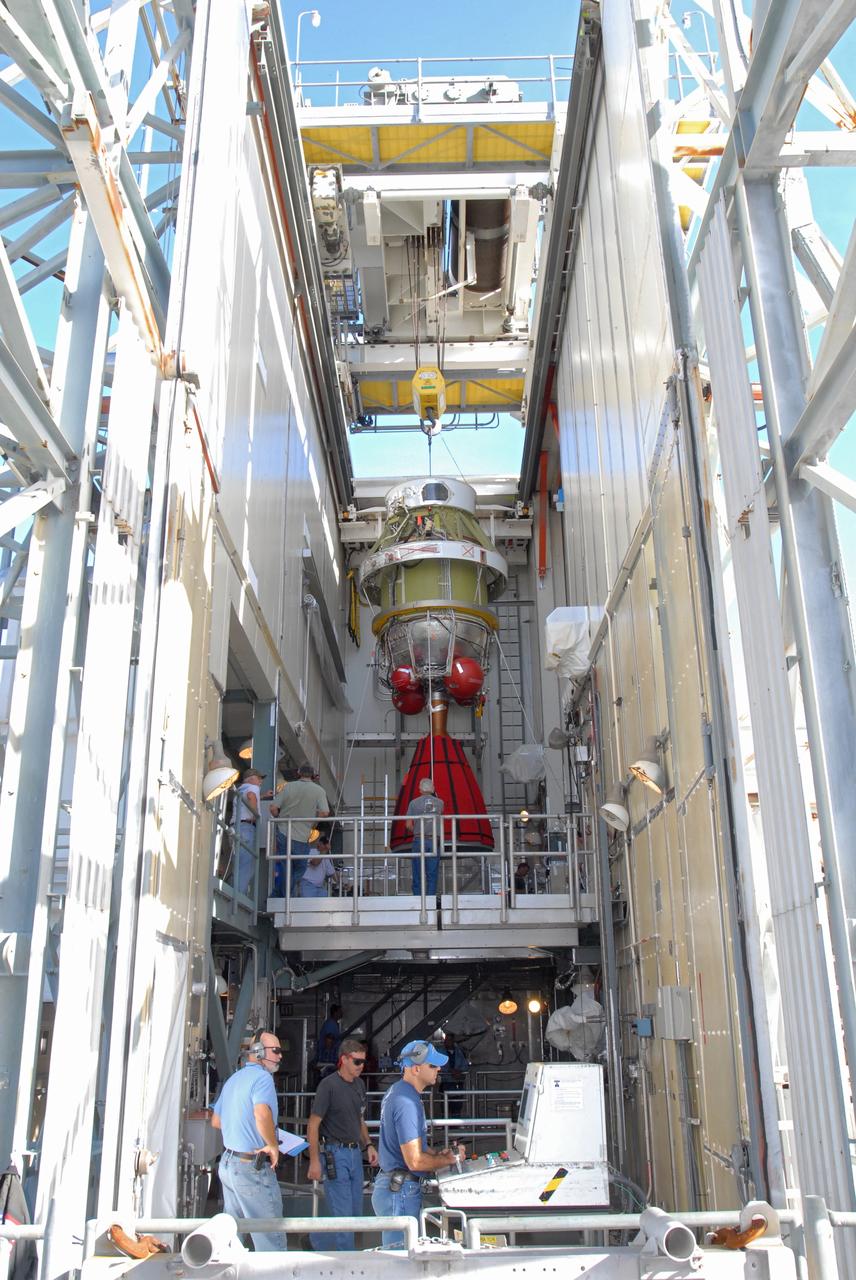 CAPE CANAVERAL, Fla. -- On Complex 17-B at Cape Canaveral Air Force Station in Florida, workers guide the second stage of the Delta 2 rocket into place inside the mobile service tower. The second stage will be mated to the first stage of the Delta 2 for the launch of NASA's Kepler spacecraft. The Kepler mission is specifically designed to survey our region of the Milky Way galaxy to discover hundreds of Earth-size and smaller planets in or near the habitable zone and determine how many of the billions of stars in our galaxy have such planets. Results from this mission will allow us to place our solar system within the continuum of planetary systems in the Galaxy. NASA's planet-hunting Kepler mission is scheduled to launch no earlier than March 5, 2009. Photo credit: NASA/Jim Grossmann