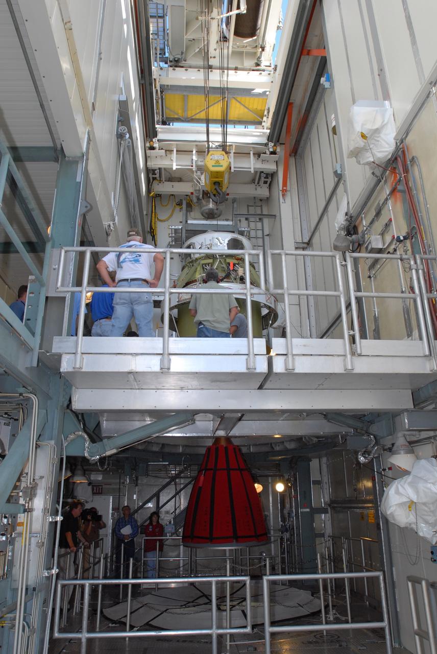 CAPE CANAVERAL, Fla. -- On Complex 17-B at Cape Canaveral Air Force Station in Florida, the second stage of the Delta 2 rocket is lowered toward the first stage. The two second stages will be mated for launch of NASA's Kepler spacecraft. The Kepler mission is specifically designed to survey our region of the Milky Way galaxy to discover hundreds of Earth-size and smaller planets in or near the habitable zone and determine how many of the billions of stars in our galaxy have such planets. Results from this mission will allow us to place our solar system within the continuum of planetary systems in the Galaxy. NASA's planet-hunting Kepler mission is scheduled to launch no earlier than March 5, 2009. Photo credit: NASA/Jim Grossmann