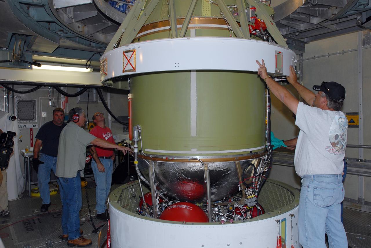 CAPE CANAVERAL, Fla. -- On Complex 17-B at Cape Canaveral Air Force Station in Florida, workers guide the second stage of the Delta 2 rocket for mating with the first stage. The Delta 2 is the launch vehicle for NASA's Kepler spacecraft. The Kepler mission is specifically designed to survey our region of the Milky Way galaxy to discover hundreds of Earth-size and smaller planets in or near the habitable zone and determine how many of the billions of stars in our galaxy have such planets. Results from this mission will allow us to place our solar system within the continuum of planetary systems in the Galaxy. NASA's planet-hunting Kepler mission is scheduled to launch no earlier than March 5, 2009. Photo credit: NASA/Jim Grossmann