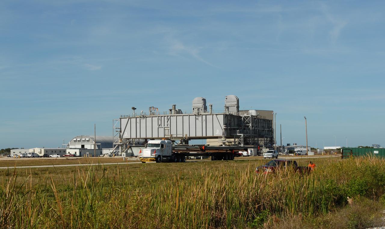 CAPE CANAVERAL, Fla. --   The Mobile Launcher truss, T4, arrives at NASA's Kennedy Space Center in Florida.  It is being delivered for the new mobile launcher to be used in the Constellation Program. The new mobile launcher will be the base for the Ares rockets to launch the Orion crew exploration vehicle and the cargo vehicle.  The base is being made lighter than space shuttle mobile launcher platforms so the crawler-transporter can pick up the added load of the 345-foot tower and taller rocket.  When the structural portion of the new mobile launcher is complete, umbilicals, access arms, communications equipment and command/control equipment will be installed. Photo credit: NASA/Jim Grossmann