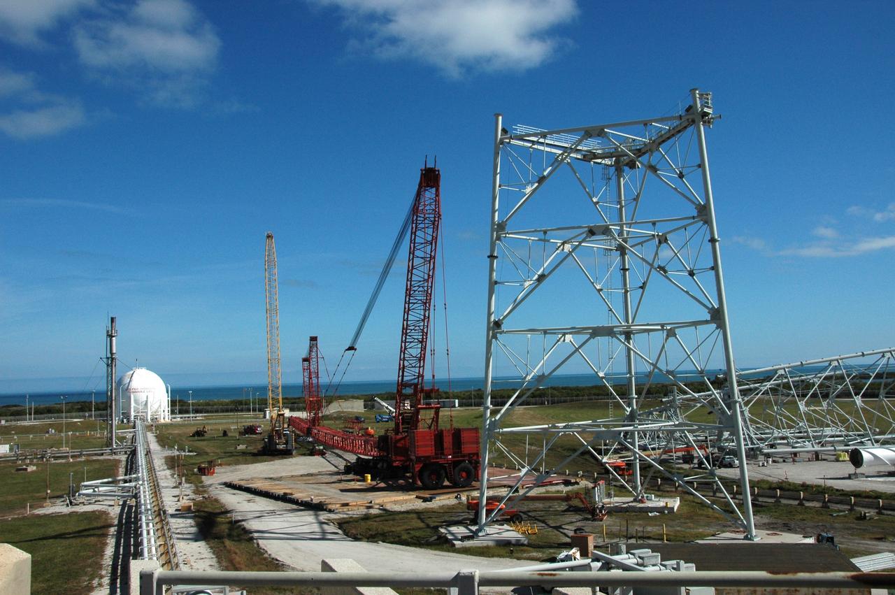 CAPE CANAVERAL, Fla. -- Very large cranes are being constructed on Launch Pad 39B at NASA's Kennedy Space Center in Florida to aid in erecting the lightning towers to hold catenary wires as part of the new lightning protection system for the Constellation Program and Ares/Orion launches. Pad 39B will be the site of the first Ares vehicle launch, including Ares I-X test flight that is targeted for July 2009. Photo credit: NASA/Tim Jacobs