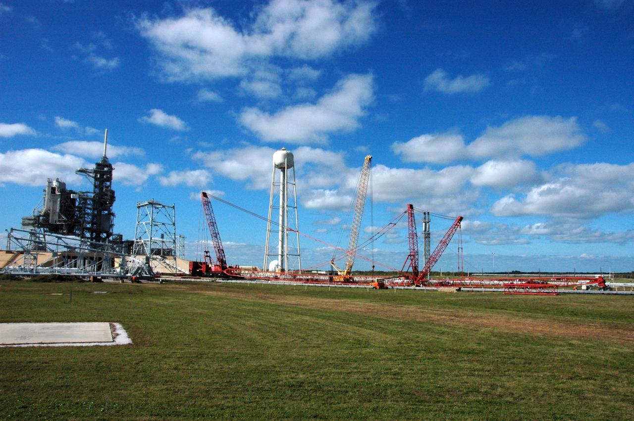 CAPE CANAVERAL, Fla. -- Very large cranes are being constructed on Launch Pad 39B at NASA's Kennedy Space Center in Florida to aid in erecting the lightning towers to hold catenary wires as part of the new lightning protection system for the Constellation Program and Ares/Orion launches.  Pad 39B will be the site of the first Ares vehicle launch, including Ares I-X test flight that is targeted for July 2009. Photo credit: NASA/Tim Jacobs